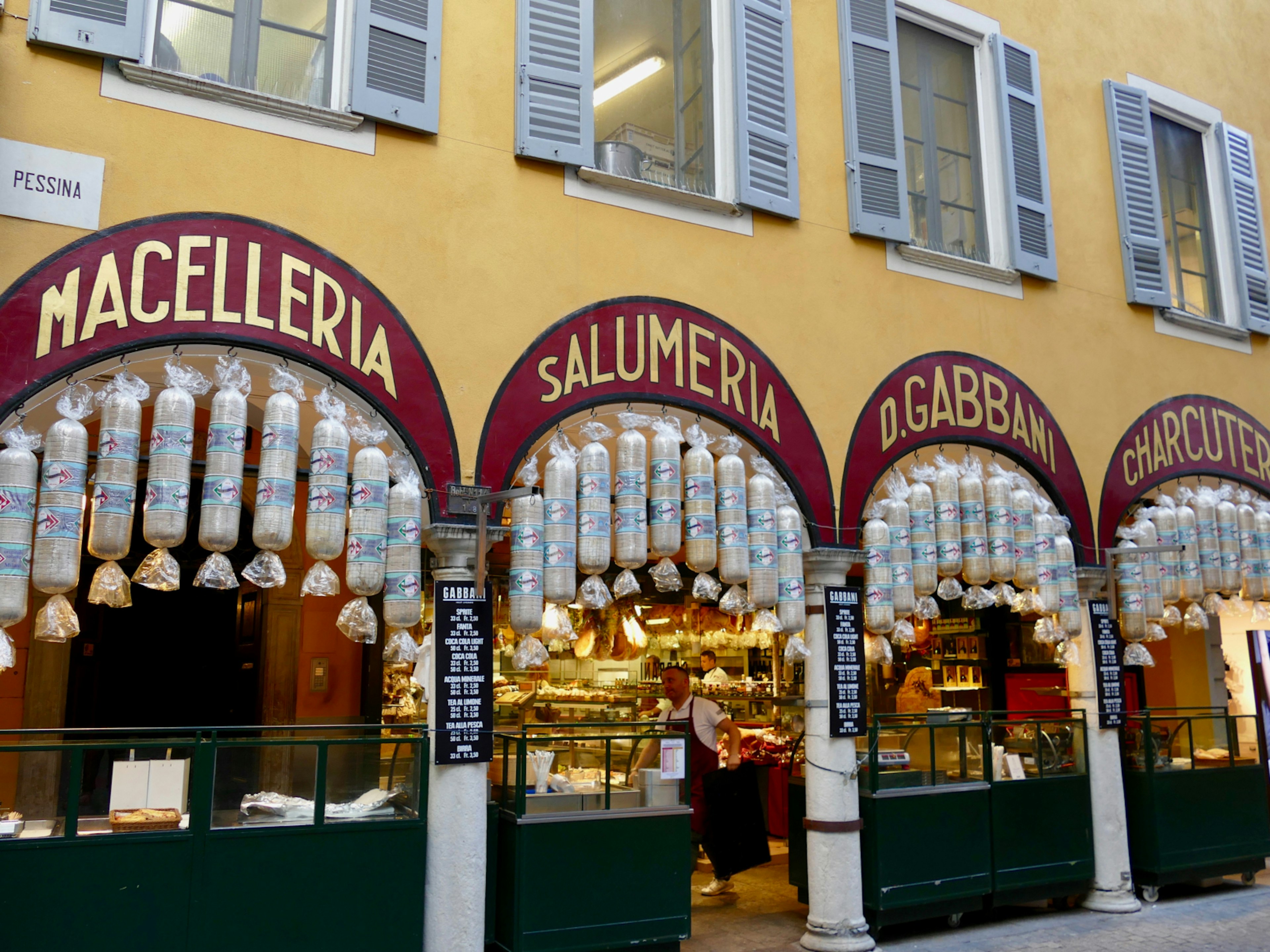 Huge salami sausages hang outside the family-run Gabbani in Lugano © Sarah Gilbert / Lonely Planet