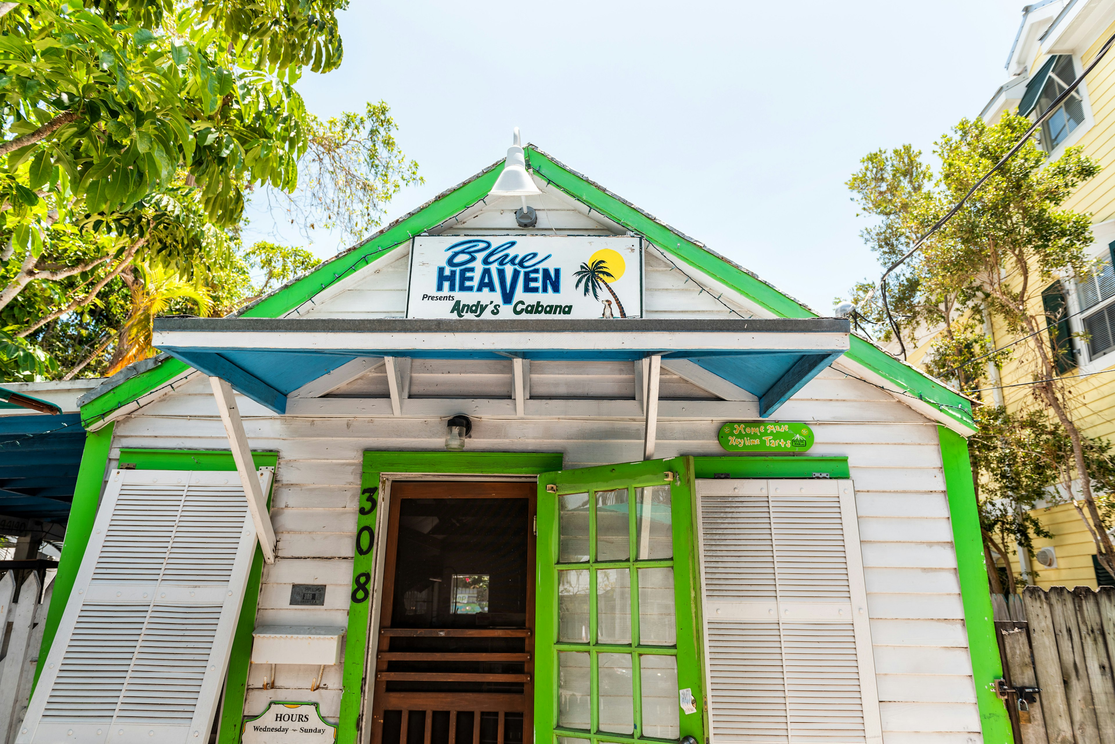 Tropical restaurant called Blue Heaven Andy's cabana, jungle style architecture in Florida on travel, sunny day, bar