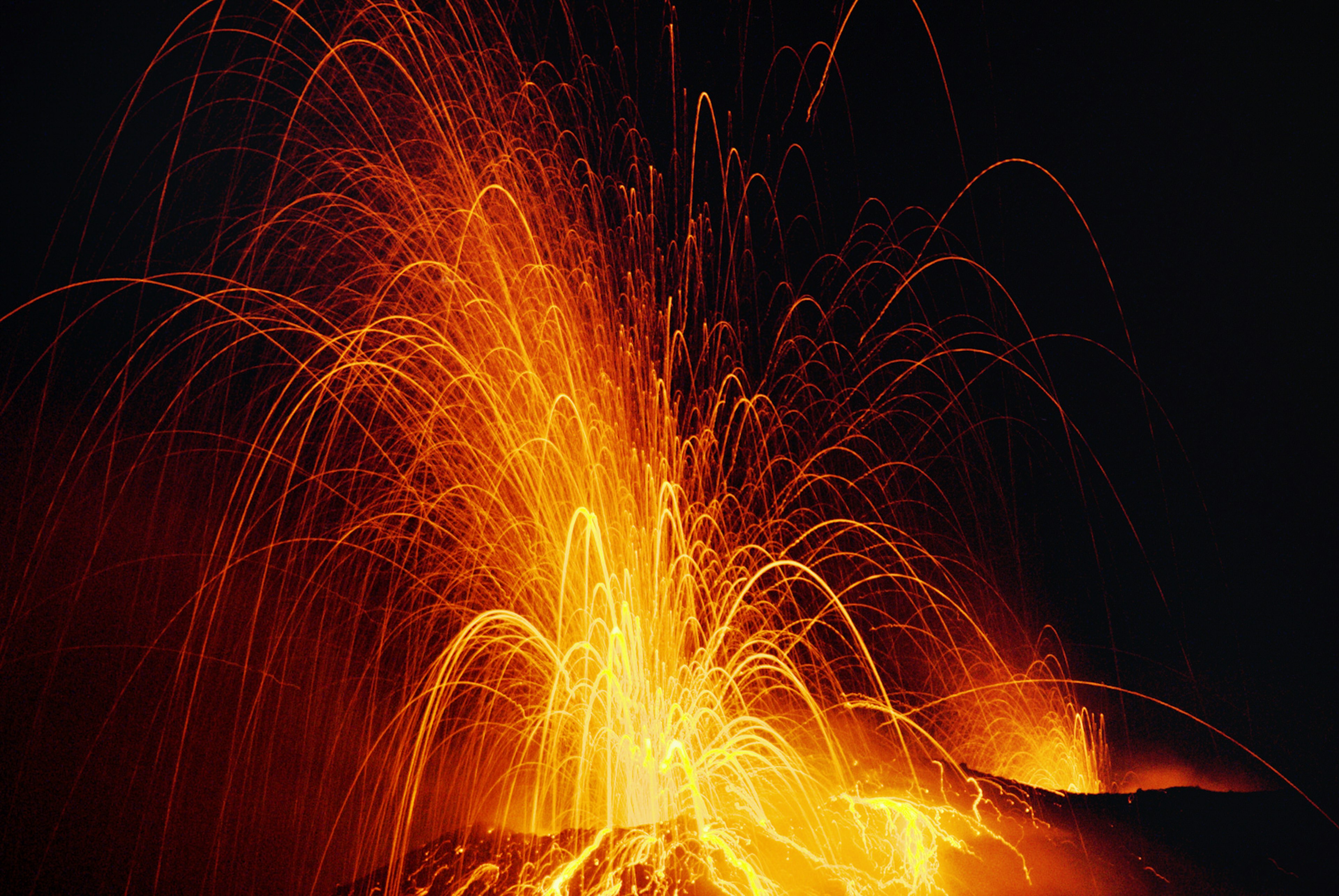 The Stromboli volcano in Italy shooting streams of lava into the night sky © Dallas Stribley / Getty Images