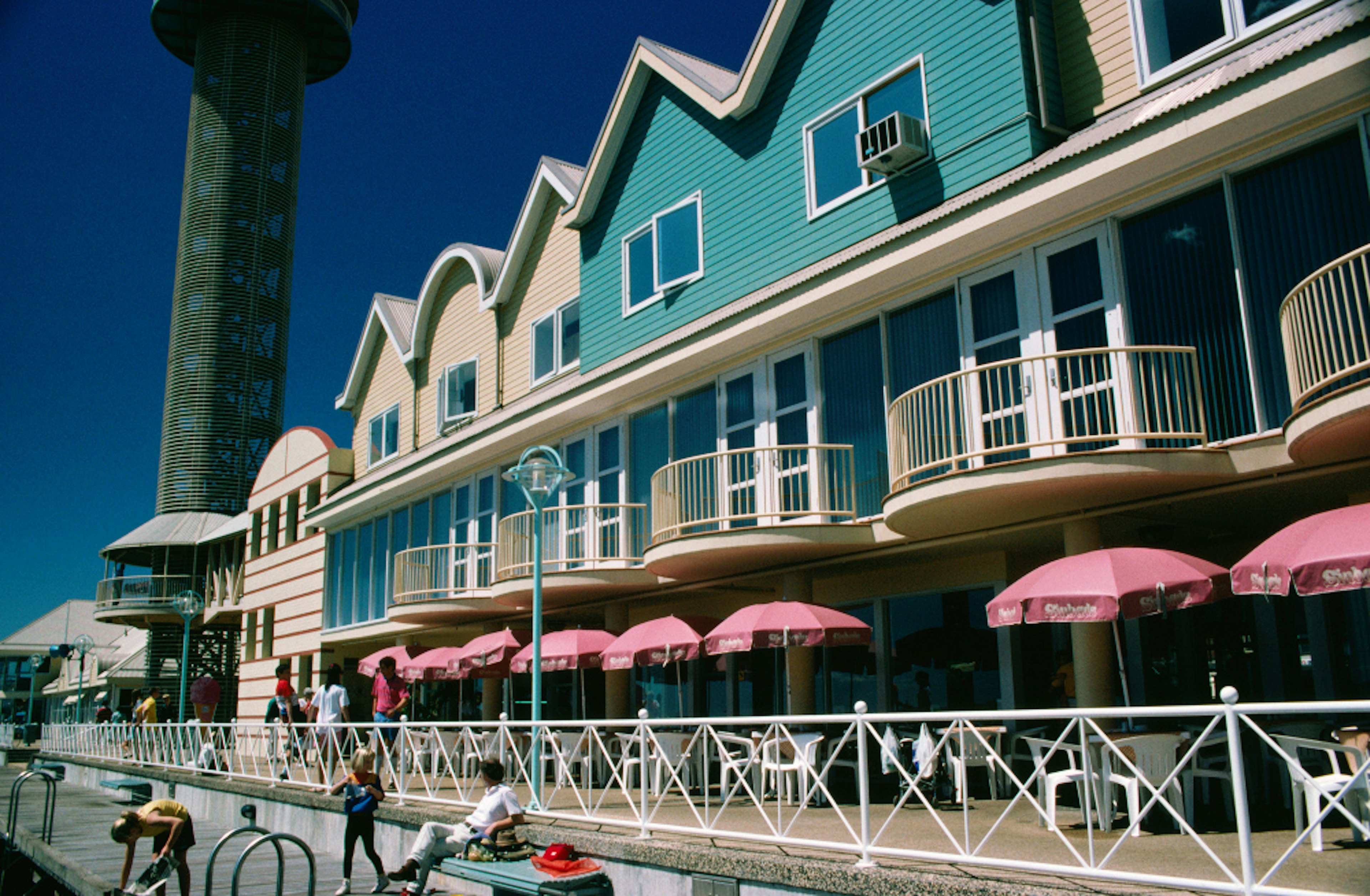 Dine in the Australian sunshine at restaurants along The Wharf. Image by John Borthwick / Getty Images