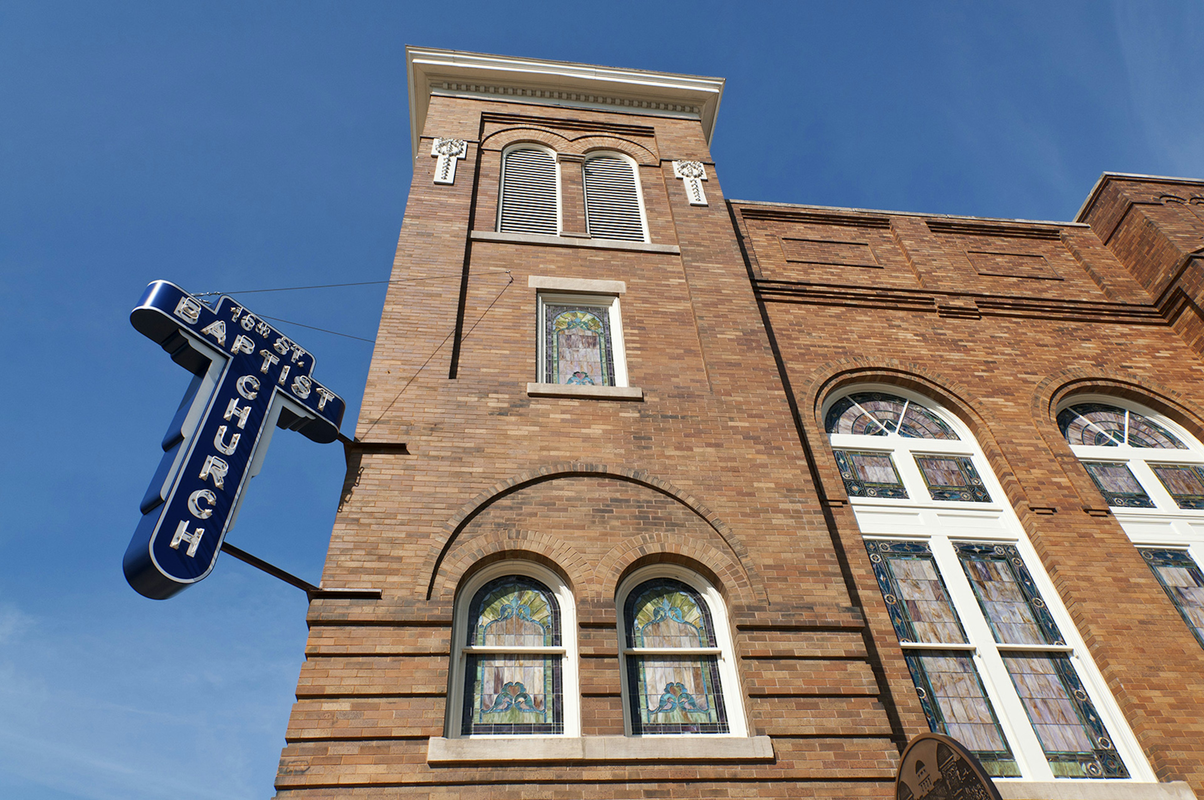 stained glass windows and brick tower of the 16th St Baptist Church in Birmingham