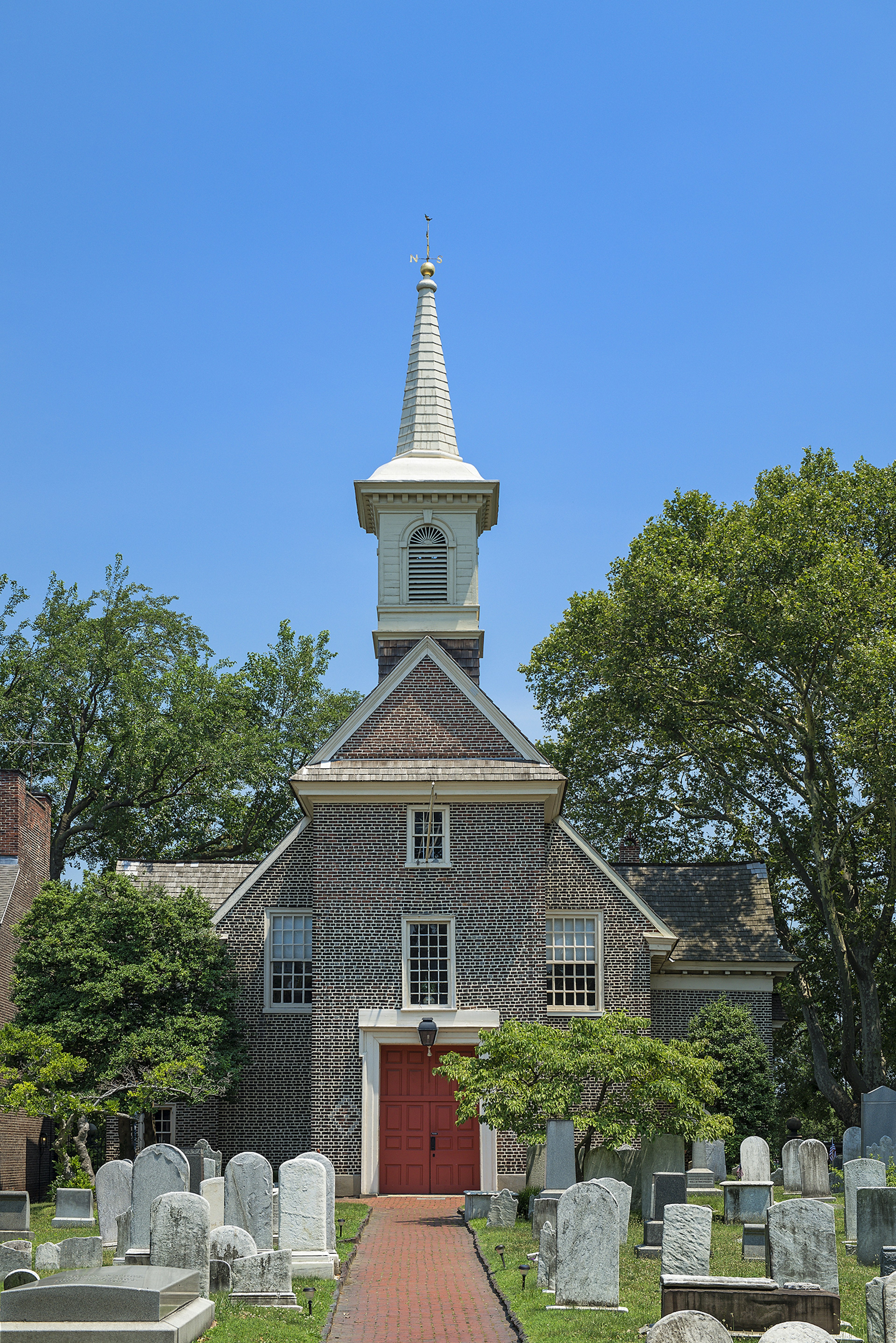 brick 17th-century church with single steeple