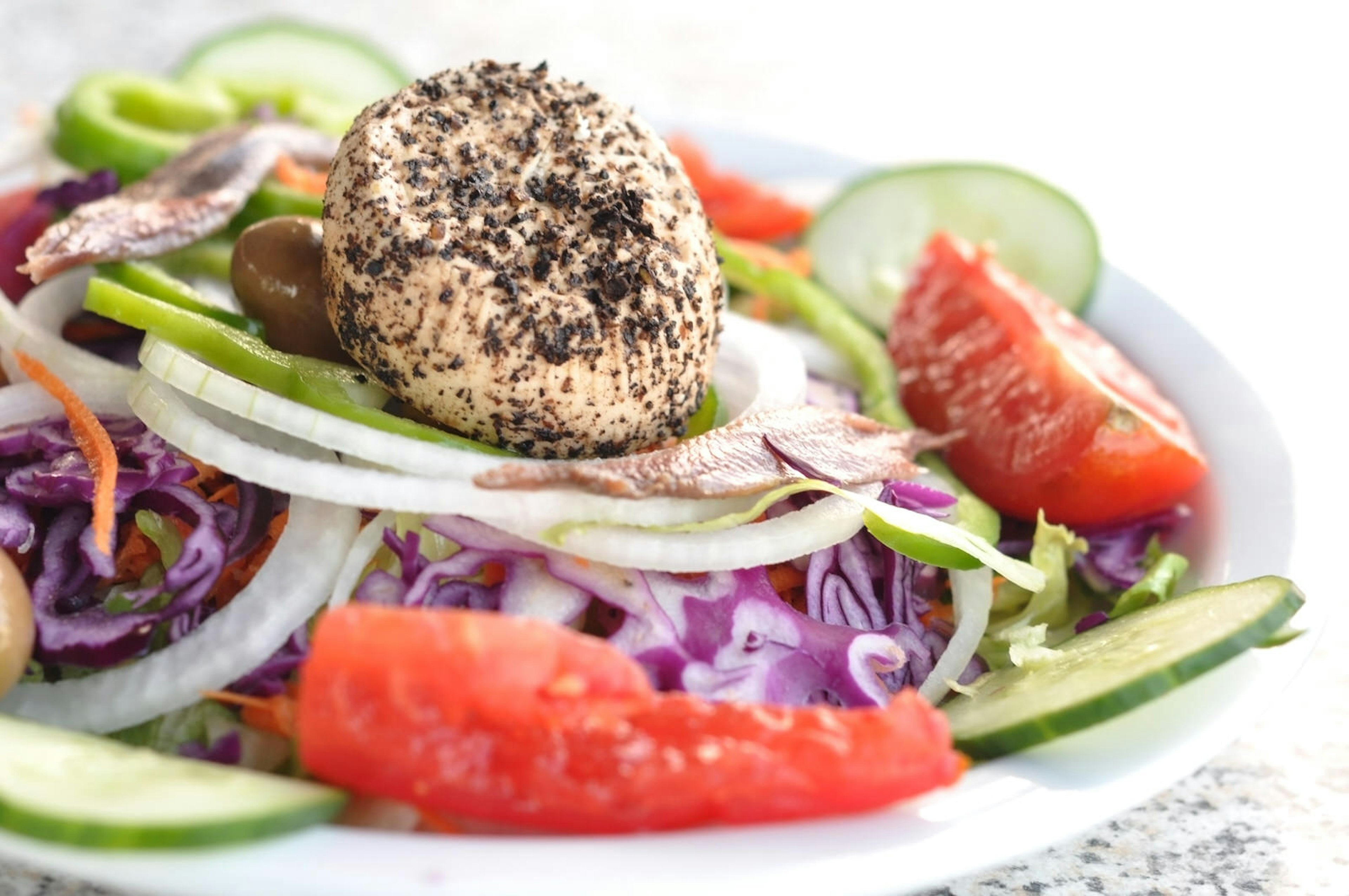 Fresh salad with peppered ġbejna cheese from Gozo