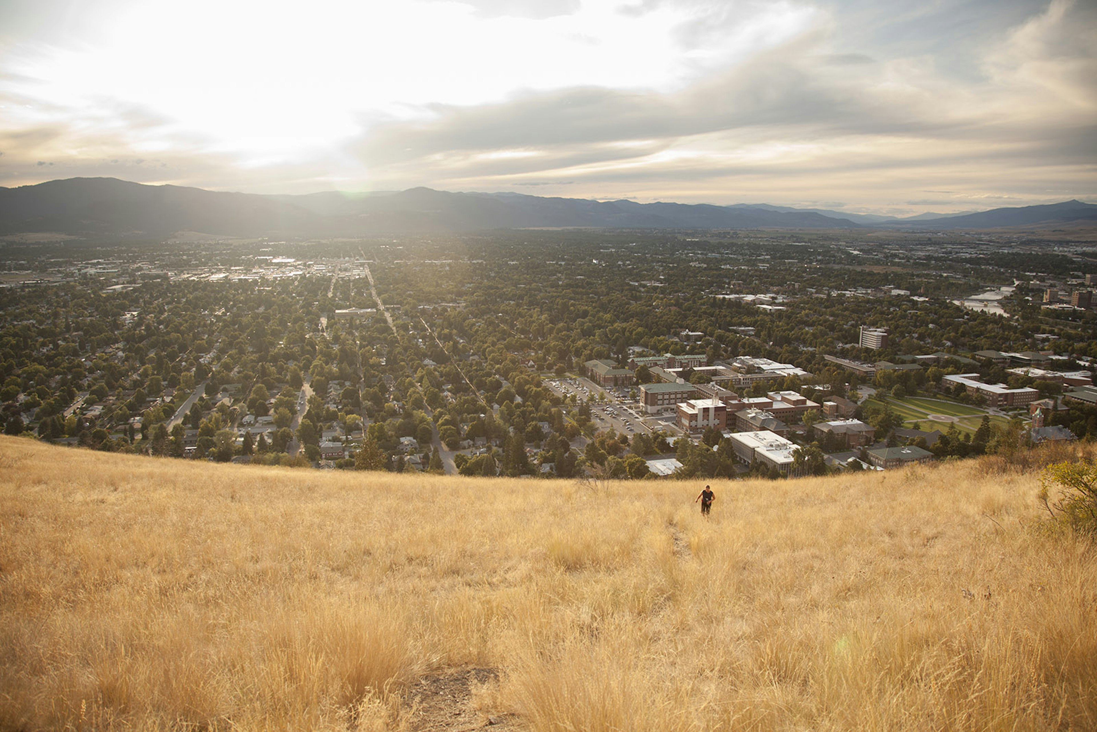 160143090
Big Sky Country, Dusk, Female, Gold, Grass, Green, High Angle View, Hiking, Landscape, Lifestyles, Missoula, Montana, Mountain, Mountain Culture, Mt Sentinel, One Person, Sunlight, Town, Tree, University of Montana, Valley
Individual hiker works her way up a hill overlooking Missoula, Montana in the United States.