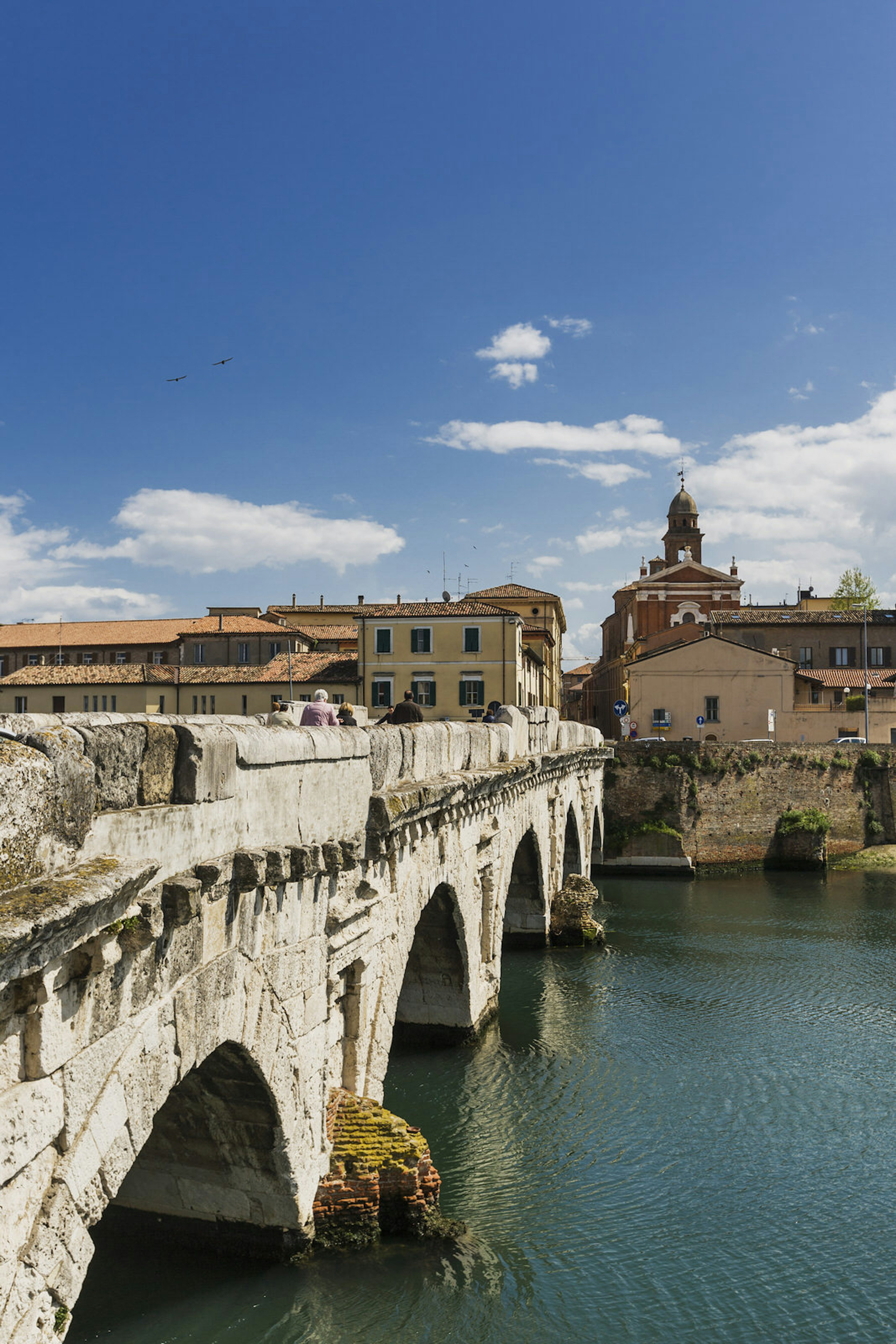 Ponte di Tiberio connects the city centre to the old fishing quarter of Borgo San Giuliano