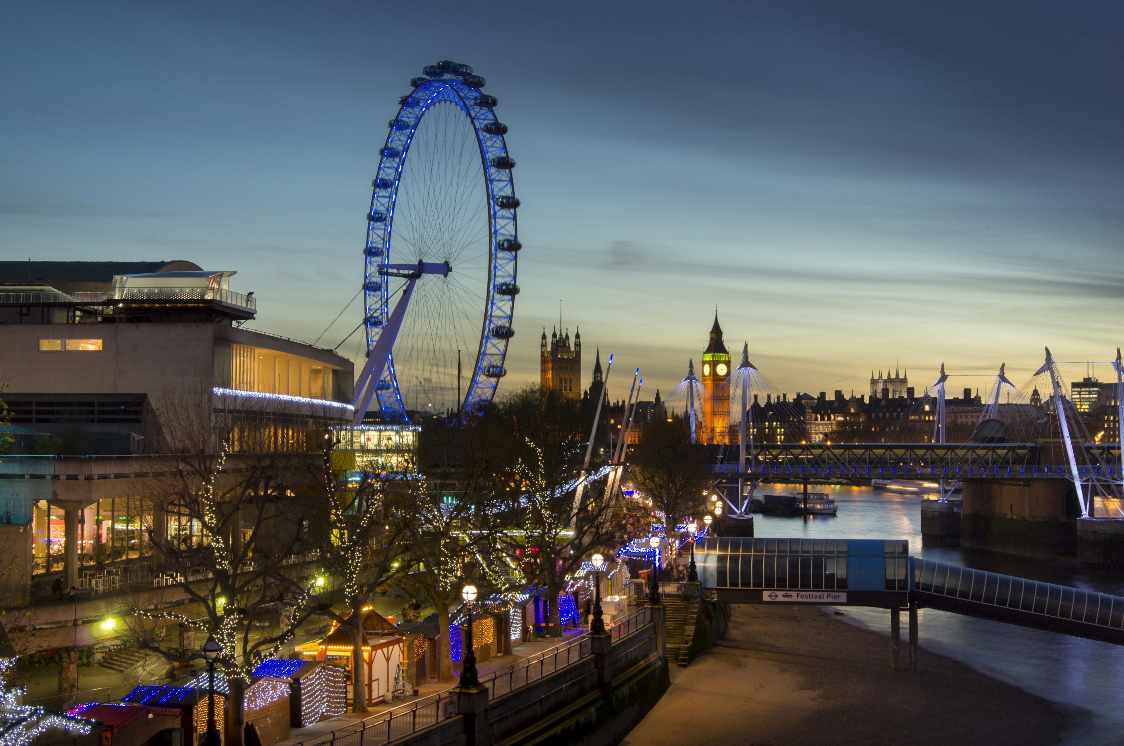 View of the London Eye and Big Ben from Waterloo Bridge at sunset