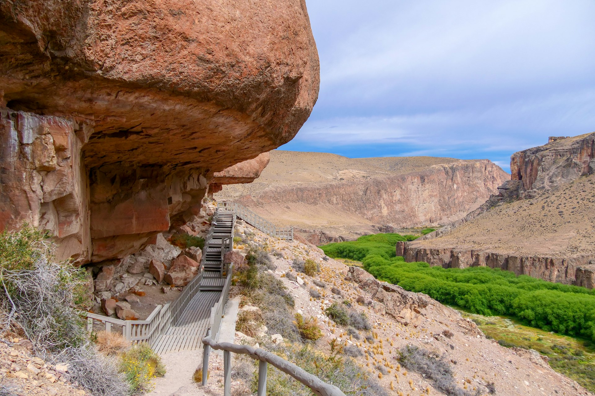 Rock ledge on Rio Pinturas where famous rock paintings of handprints and animals are located.  Location: Cueva de las Manos, UNESCO World Heritage Site, Patagonia, Argentina