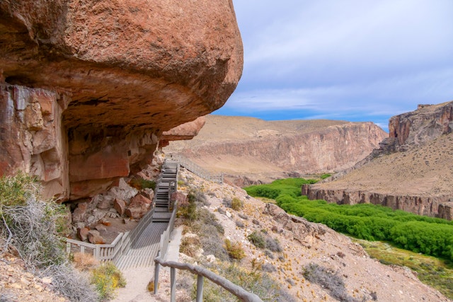 Rock ledge on Rio Pinturas where famous rock paintings of handprints and animals are located. Location: Cueva de las Manos, UNESCO World Heritage Site, Patagonia, Argentina