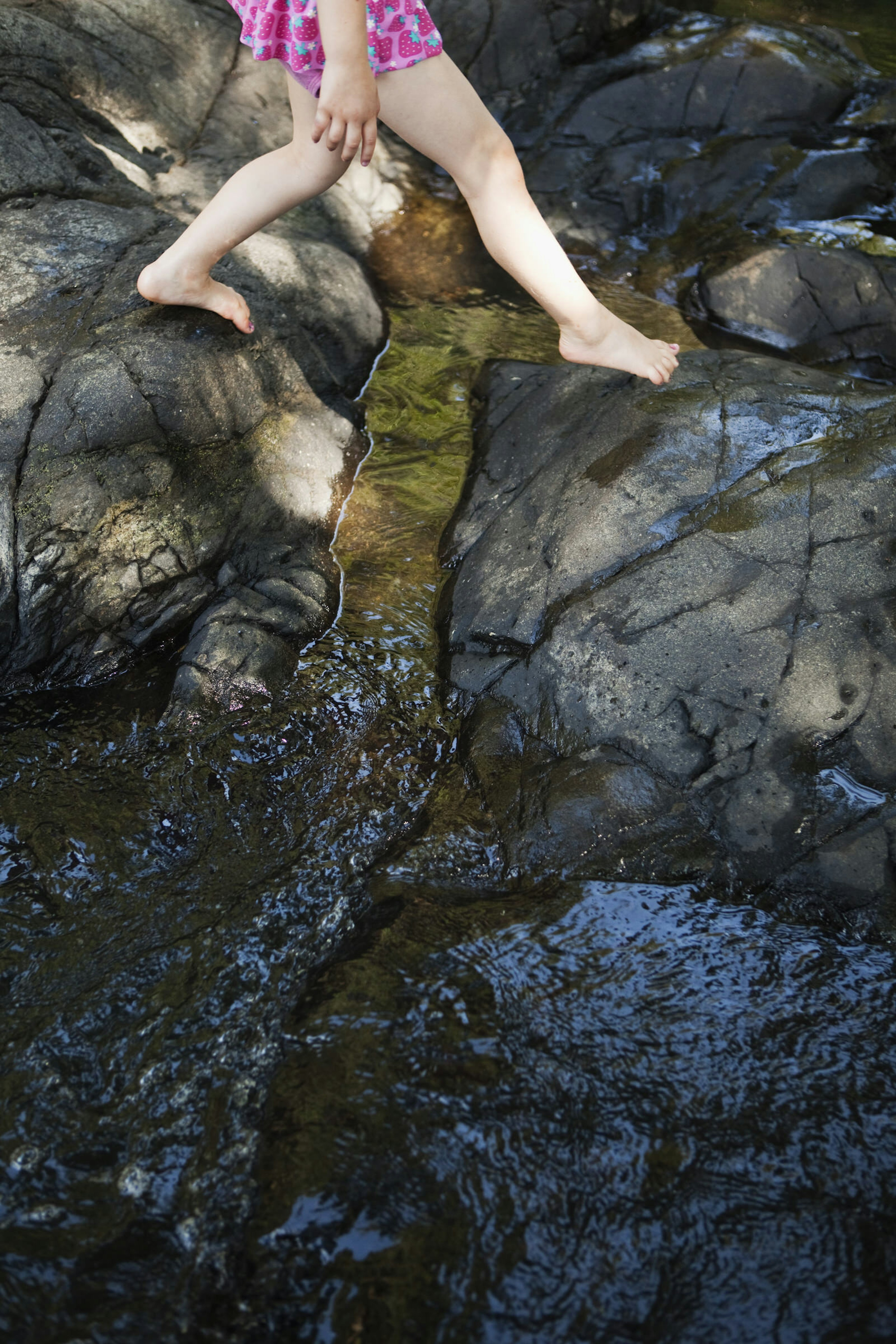 A child explores Currumbin Rock Pools, Australia