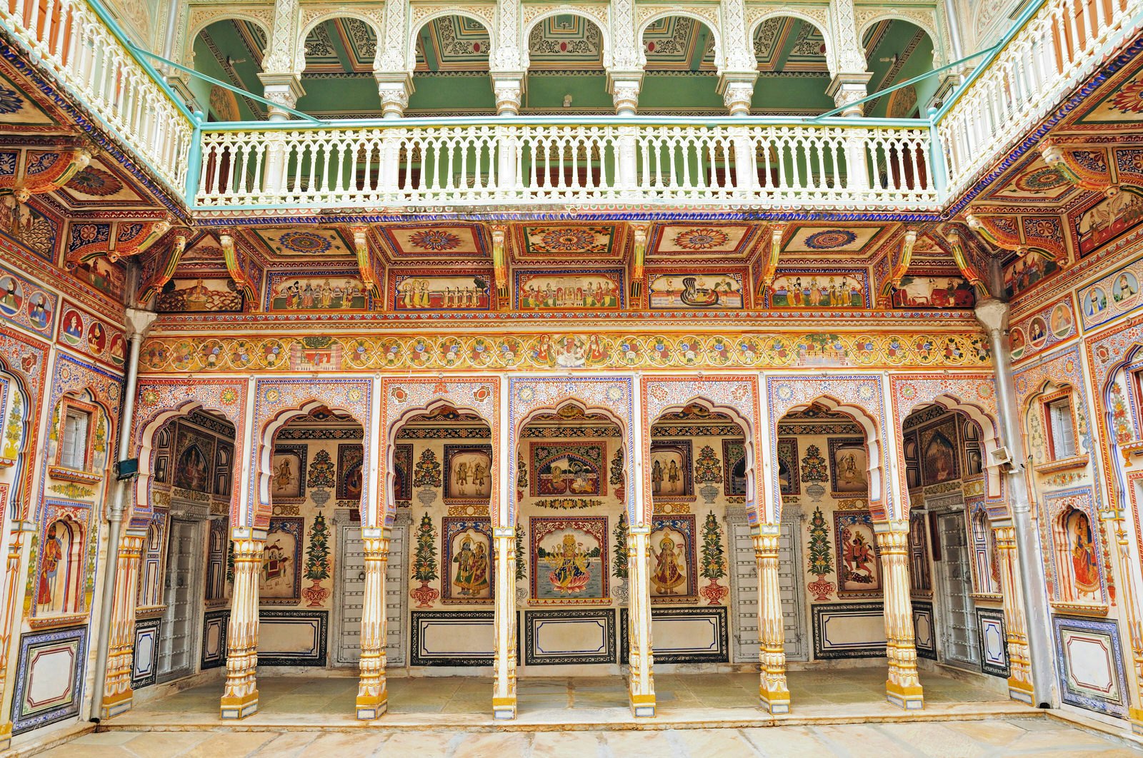 A fresco on a haveli wall in Nawalgarh, which is adorned with colourful patterns and images from floor to ceiling