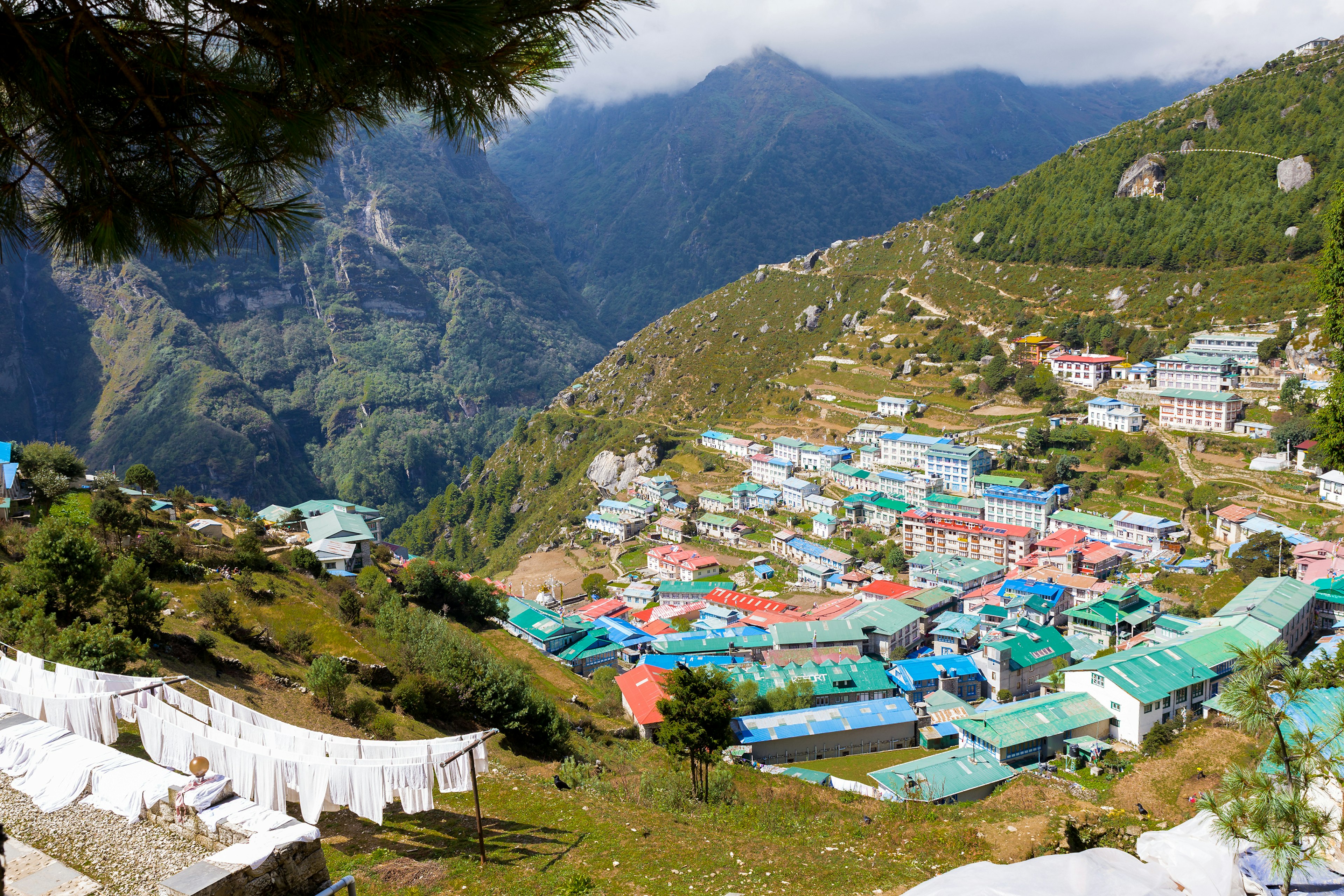 474787594
Shirt, Travel, Laundry, Building Exterior, Clothespin, String, Clothesline, Dry, Hanging, Drying, Washing, Namche Bazaar, Freshness, Multi Colored, White, Clean, In A Row, Cultures, Above, Outdoors, High Angle View, Nepal, Summer, Mountain Range, Mountain, House, Hotel, Built Structure, Village, Rope, Clothing, Sheet, Nepalese Culture
White sheets drying Namche Bazaar village, Nepal.