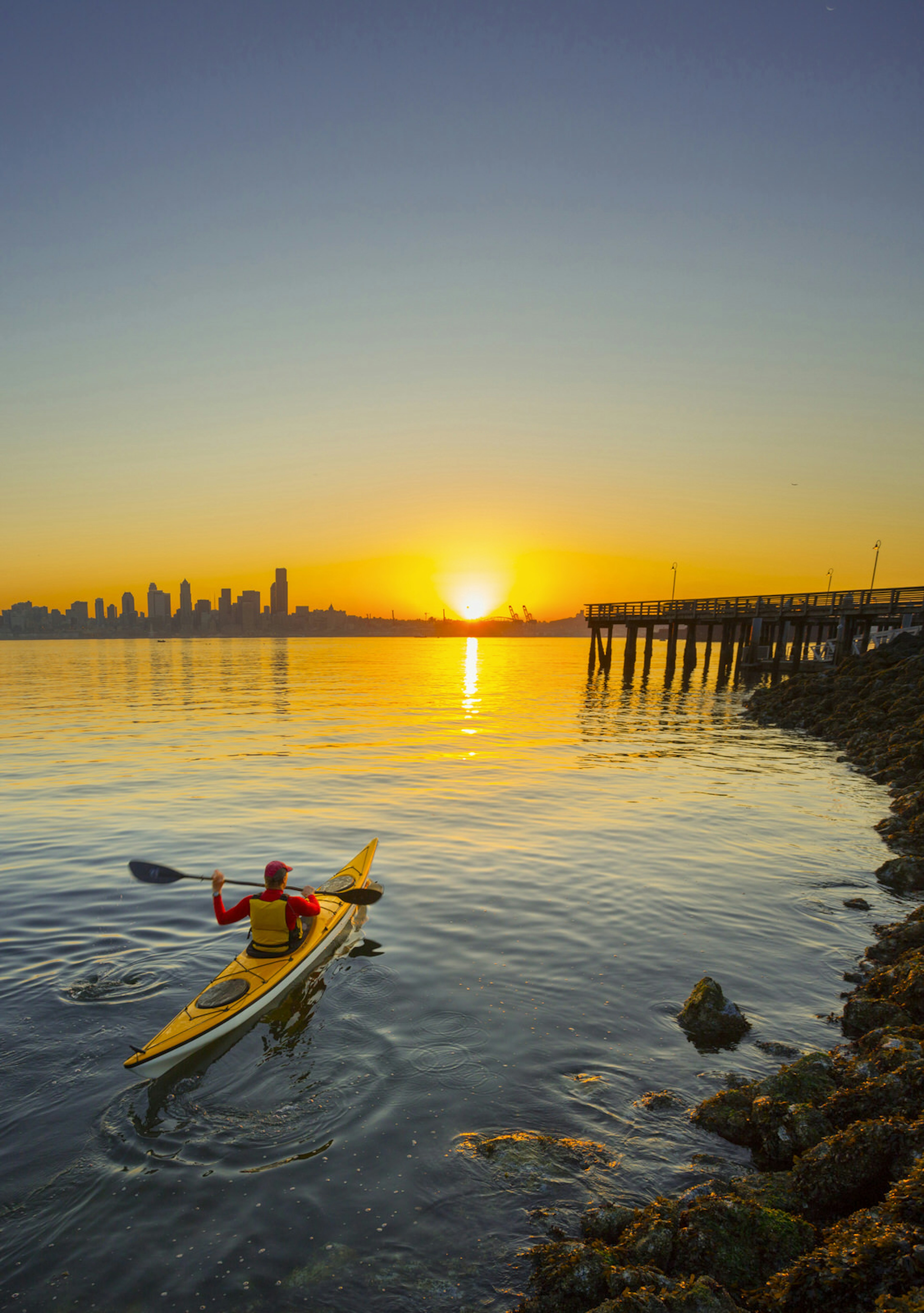 A kayaker paddles across Elliott Bay, Puget Sound