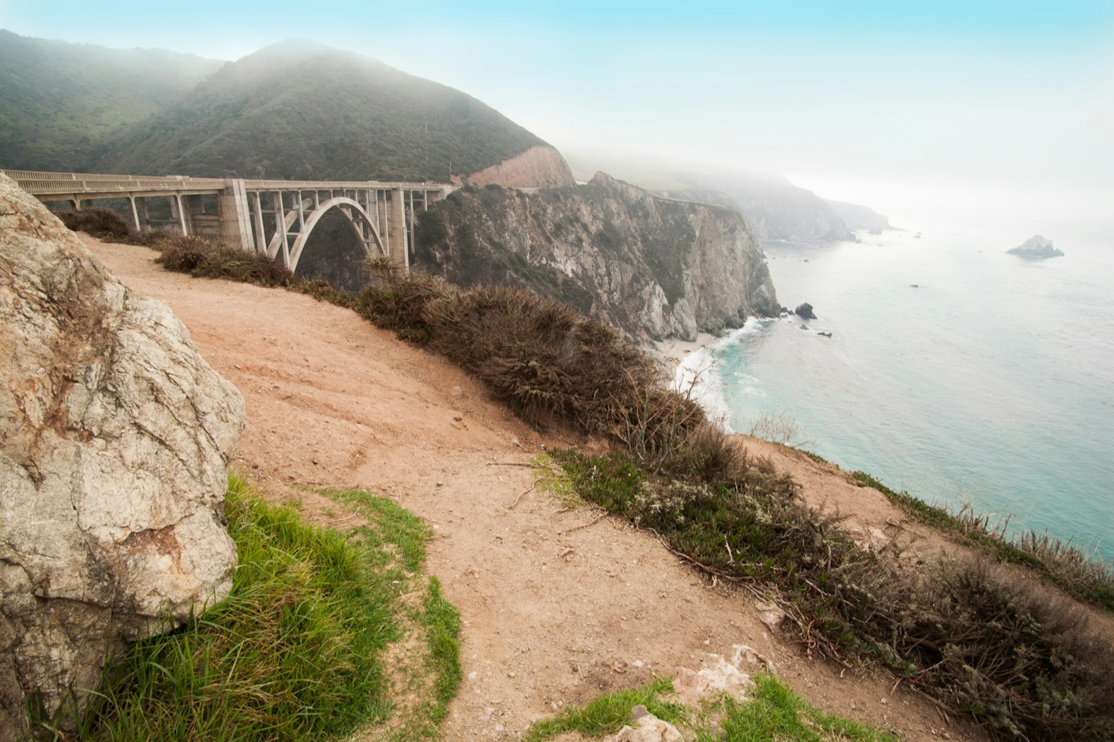 The Bixby Bridge with some fog and the ocean is a filming location in Big Little Lies