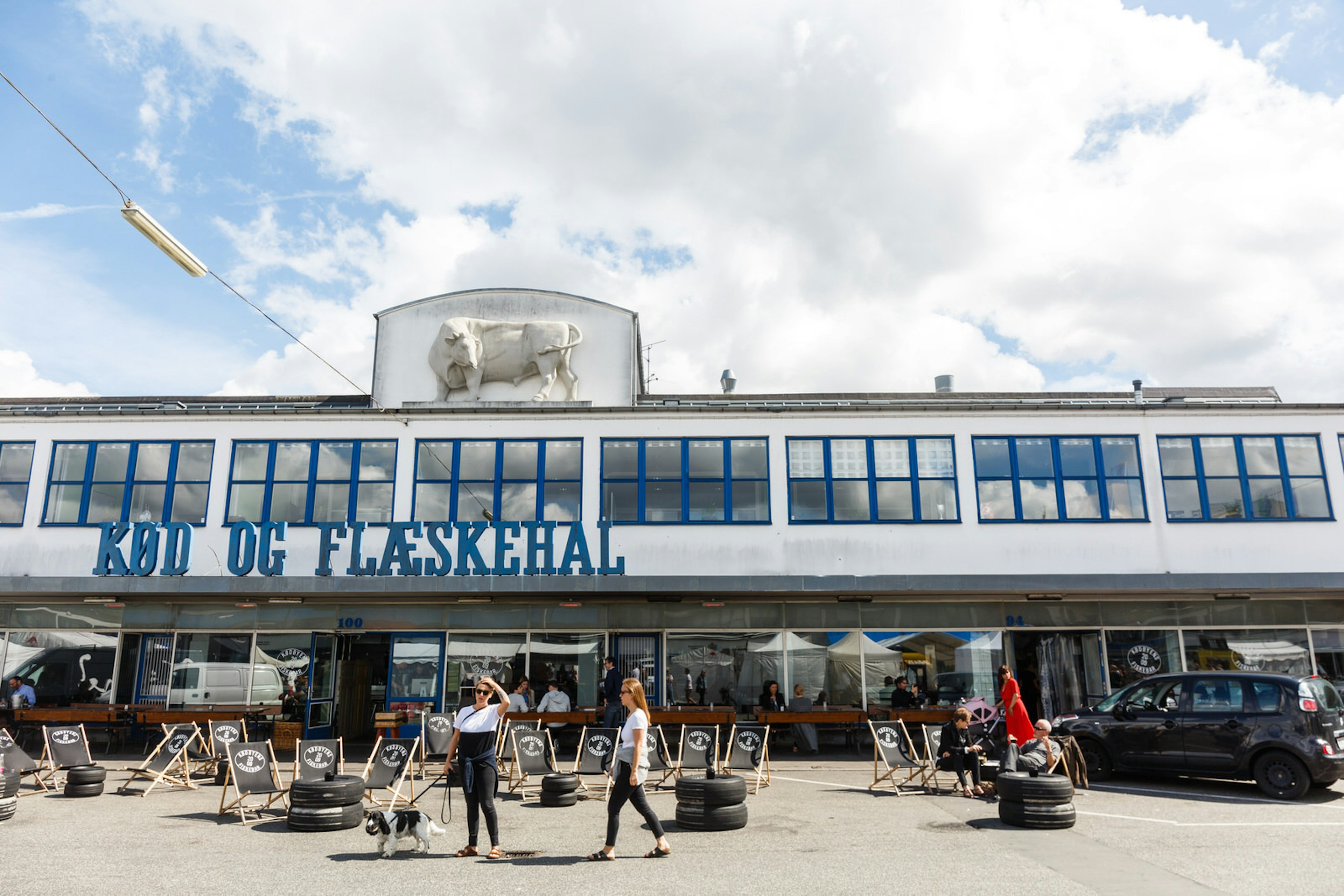 People enjoying the sunshine in Vesterbro's meatpacking district © Annapurna Mellor / Getty Images