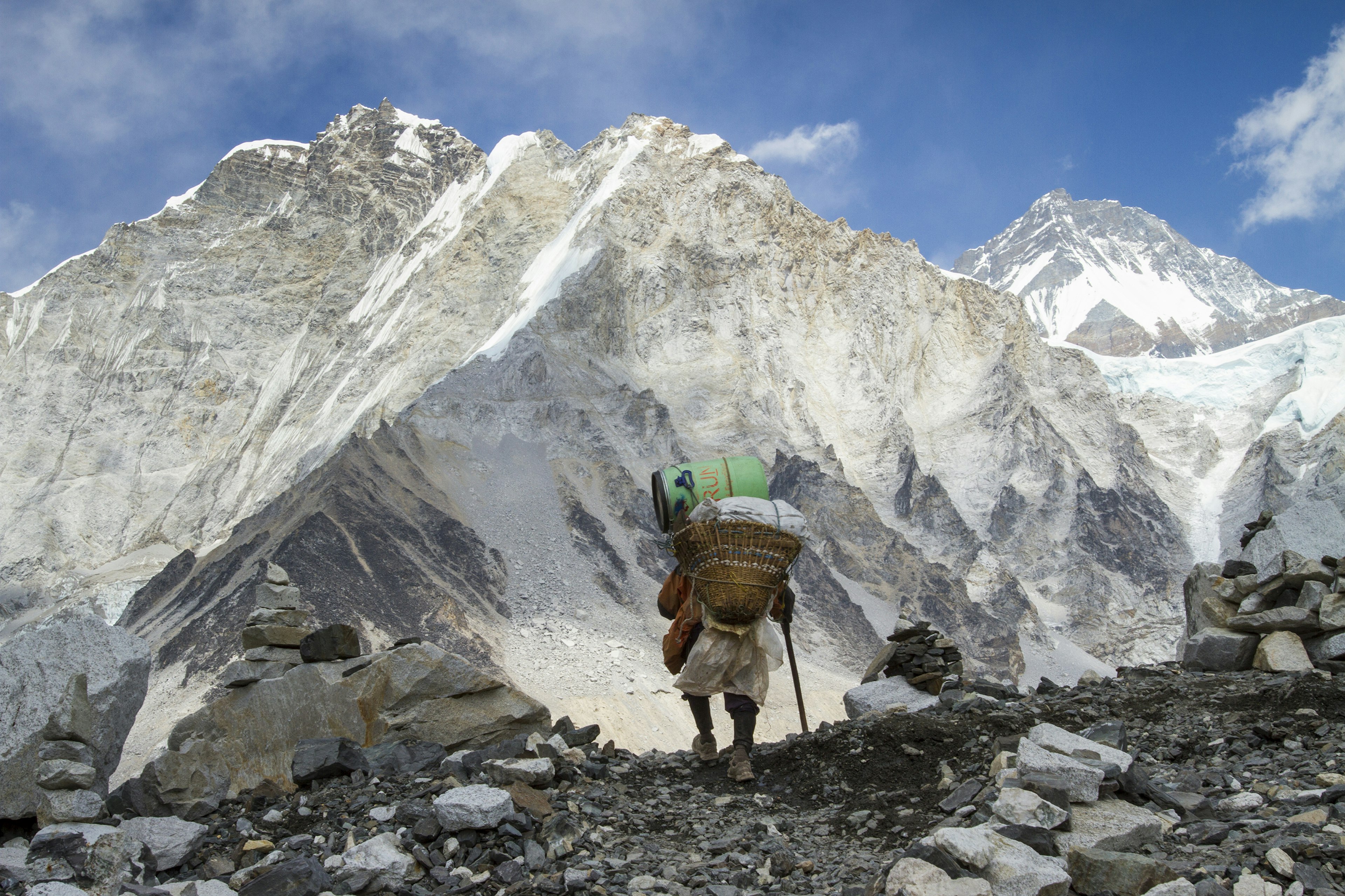 638468188
mountains, trekking
Porter arriving at Mount Everest Base Camp above the Khumbu Glacier in Nepal