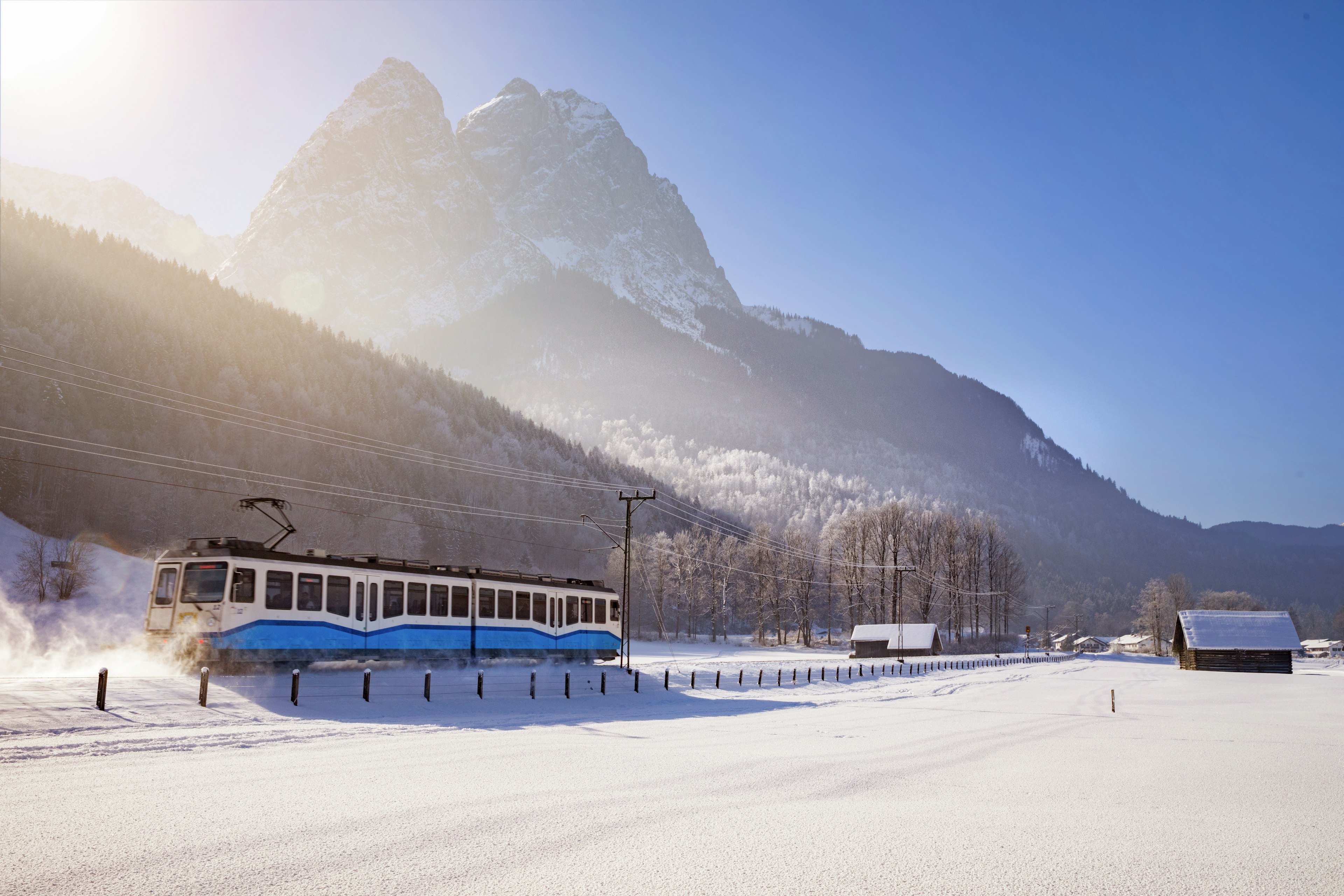 The Zugspitzbahn mountain railway passes by the foot of the Zugspitz in winter in the Bavarian Alps