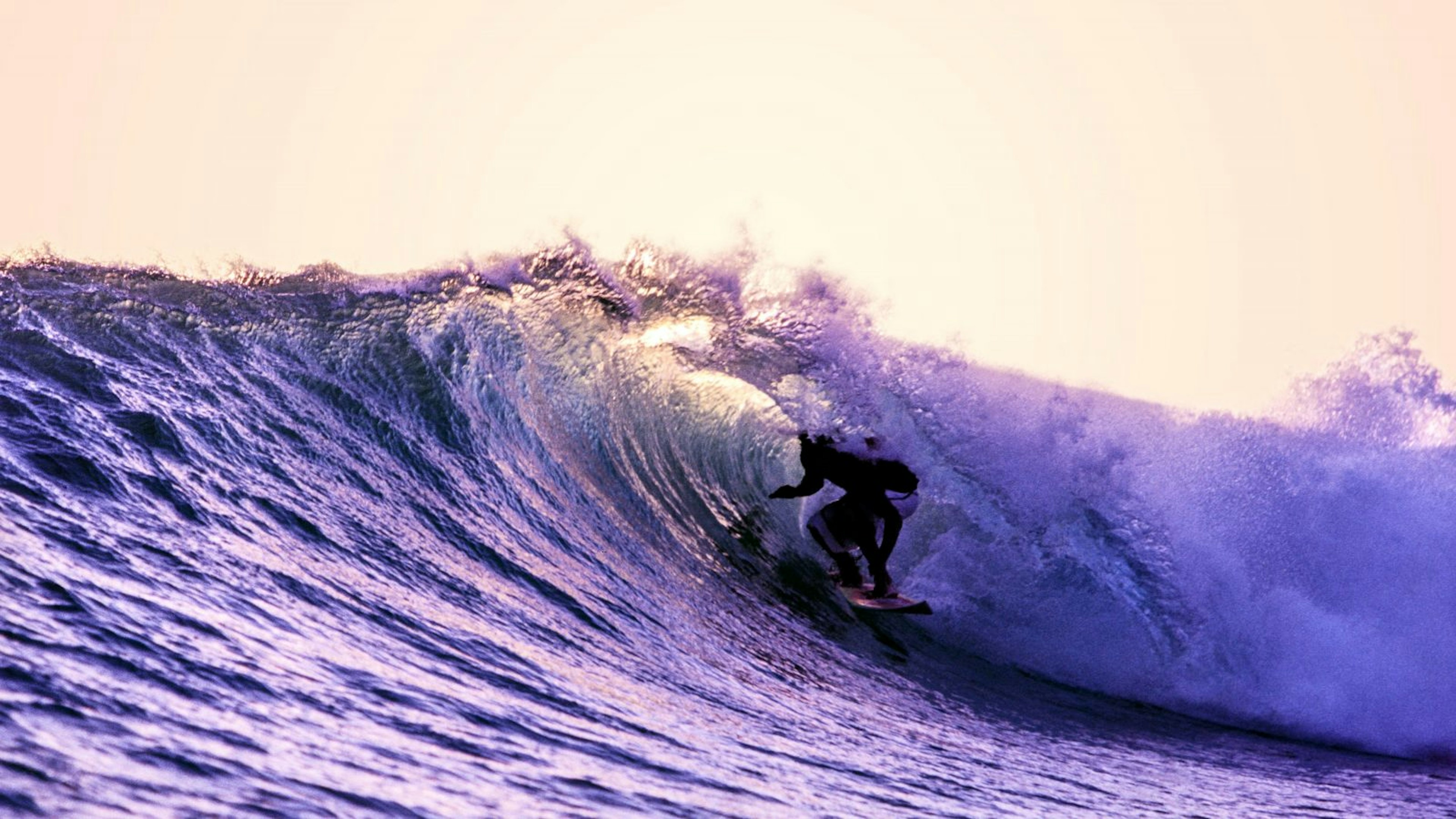 A surfer on the waves of the Savu Sea, East Nusa Tenggara, Indonesia