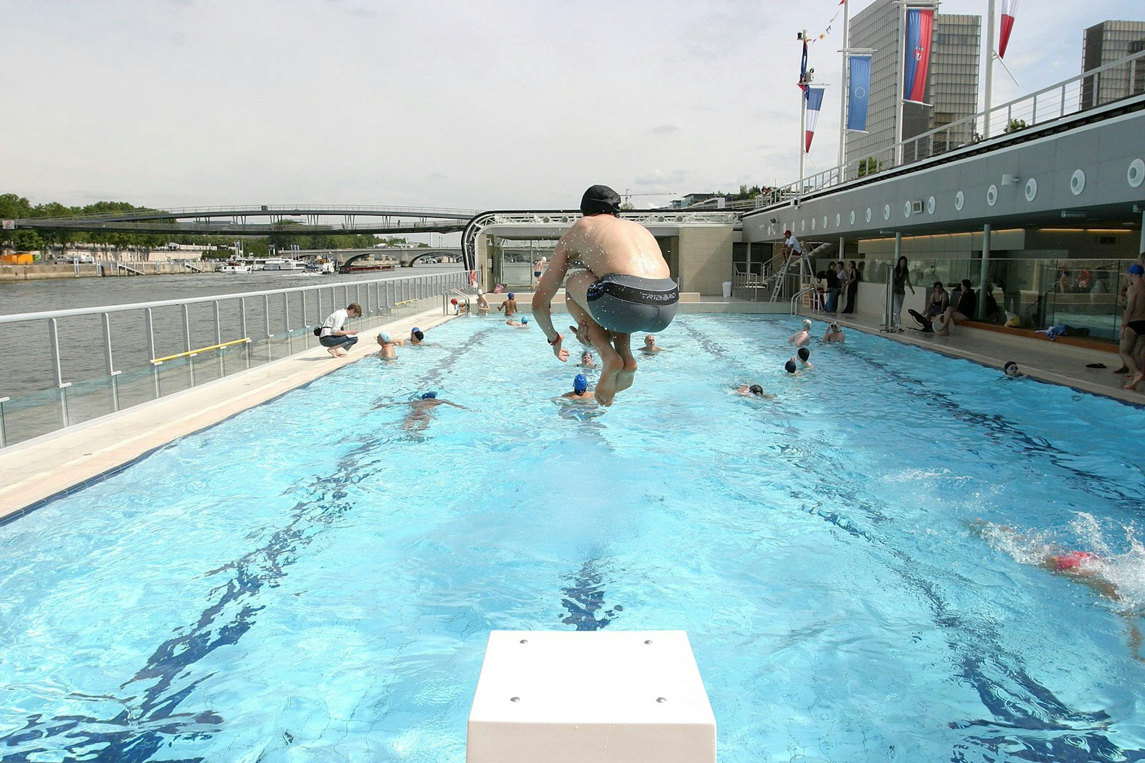 A man jumping into Paris' Piscine Josephine Baker