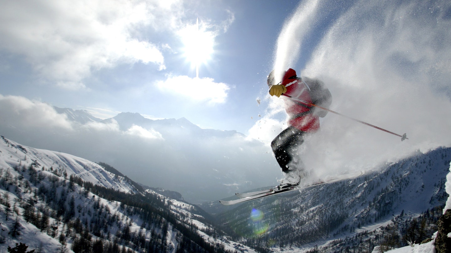 A skier in mid air in Serre Chevalier, France
