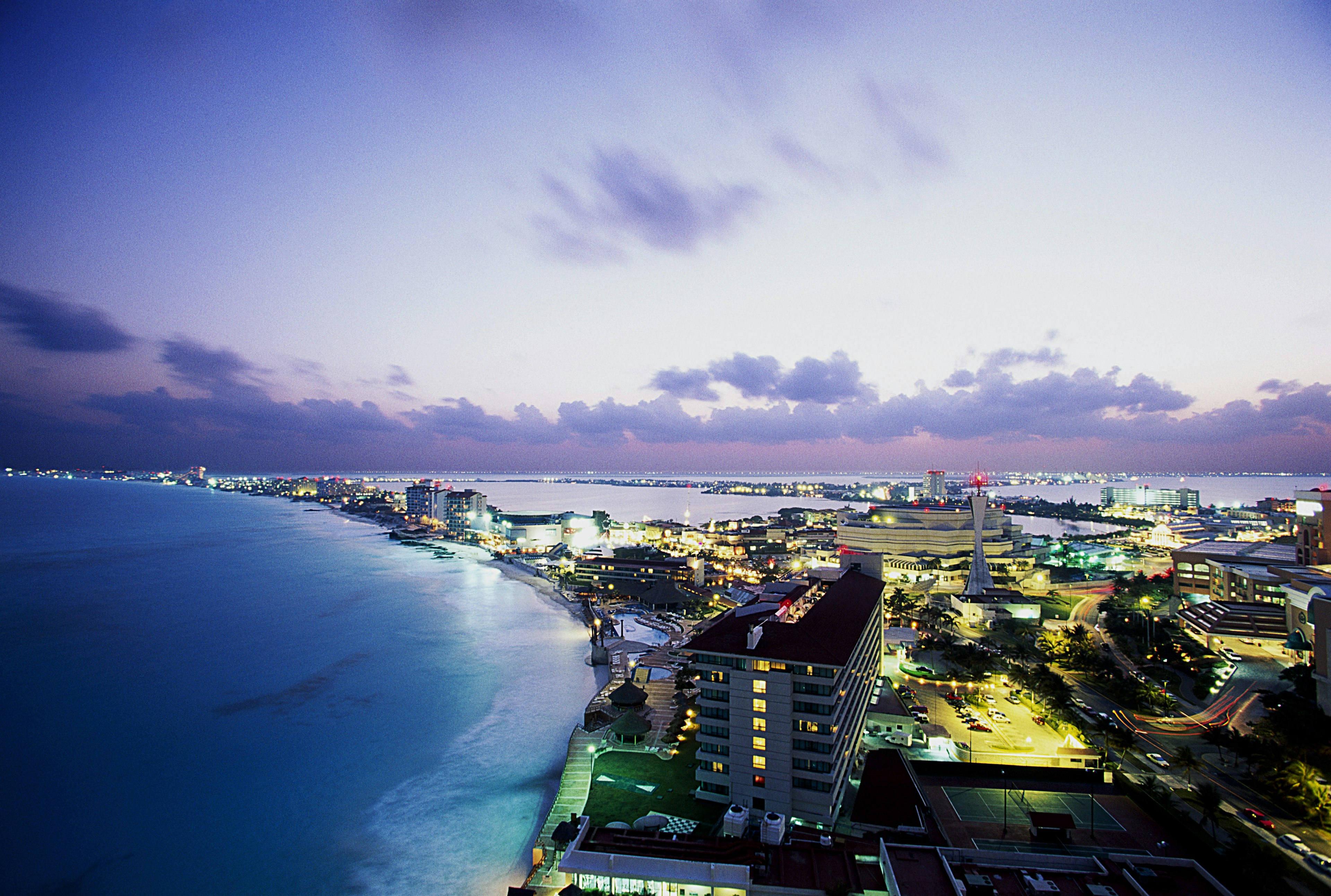 Once the sun sets in Cancún it's time to join the locals on an in-the-know night out © Brand X Pictures/Getty Images