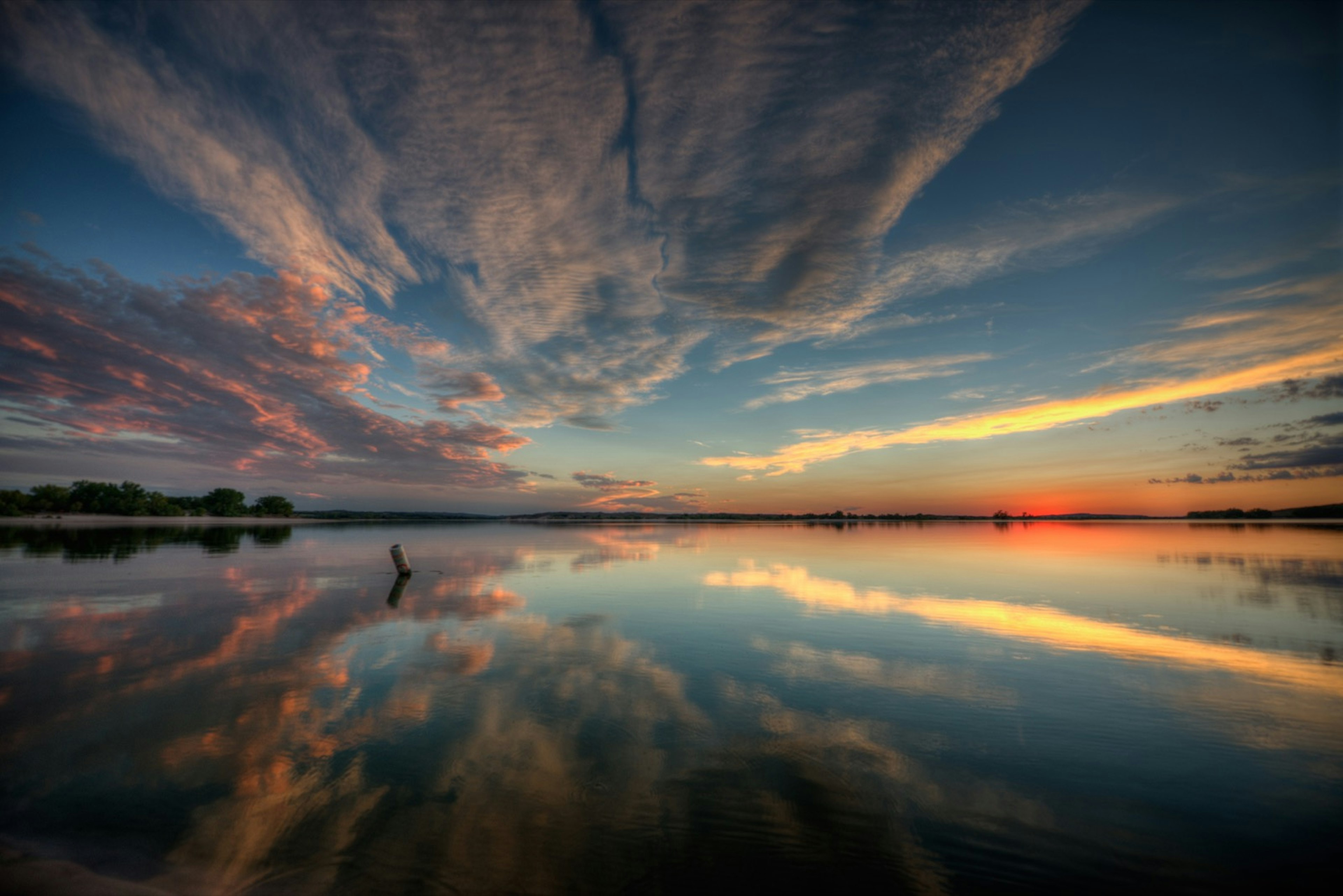 Clouds reflected in a lake at sunset in Nebraska