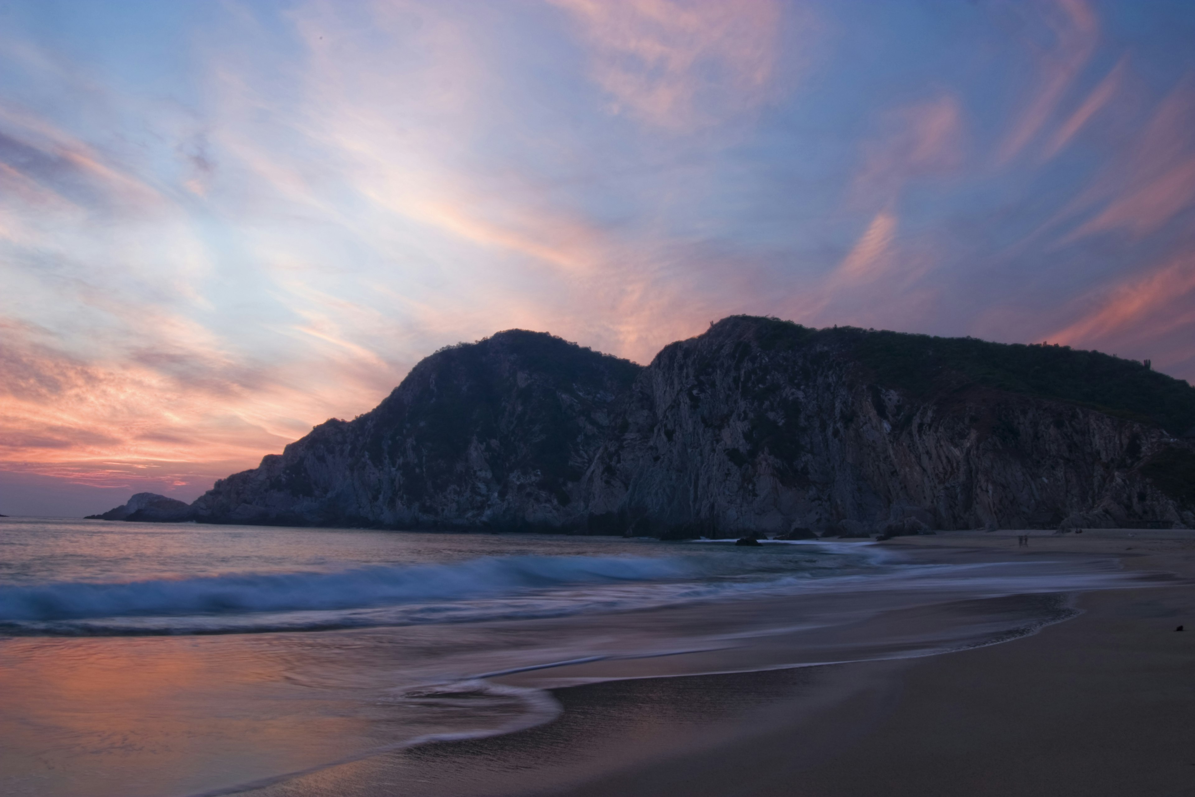 Sunsets over the water and craggy coast line of Maruata © Ethan Welty