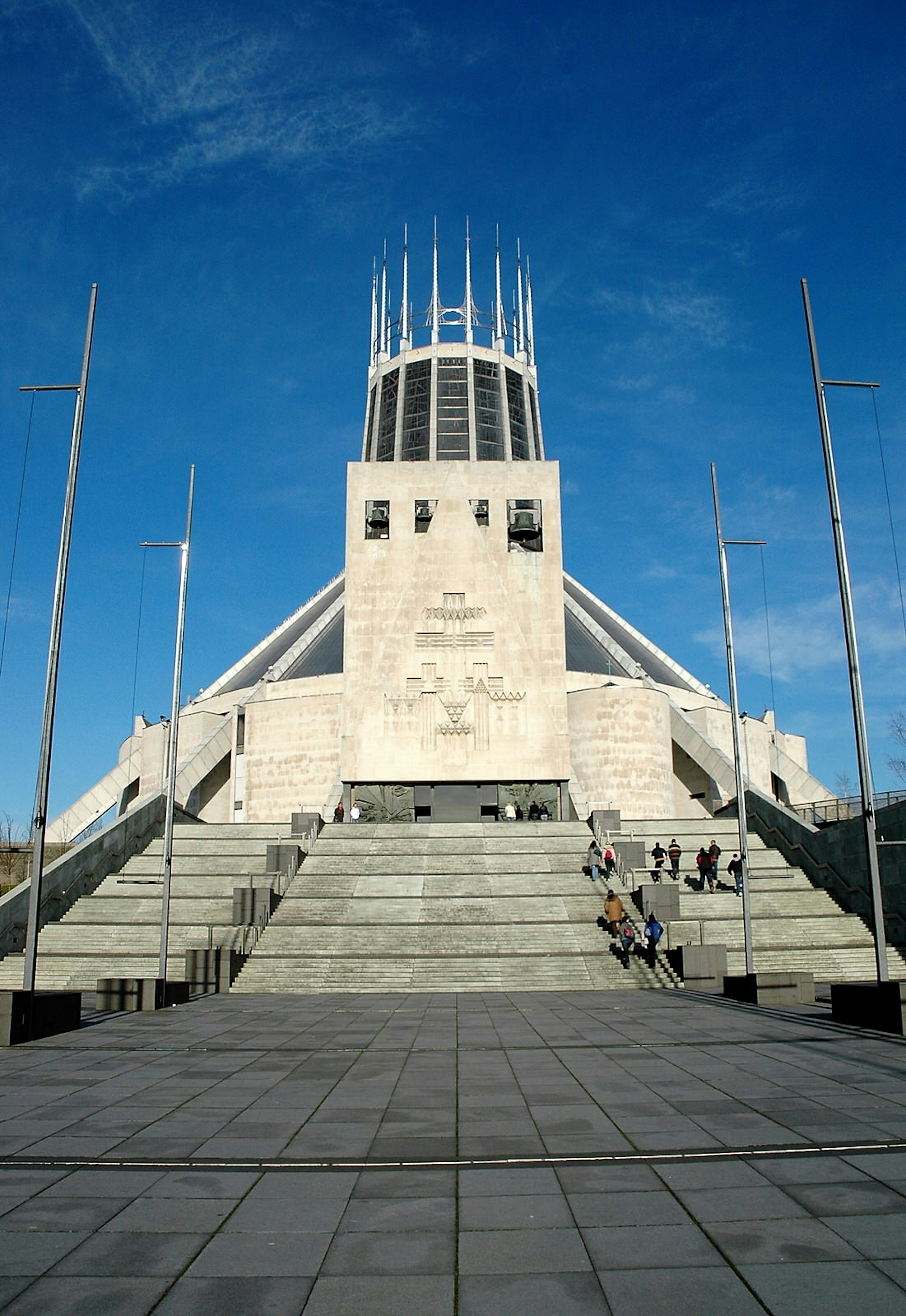 Liverpool's Catholic cathedral. The dramatic prism-like building is reached by wide, stone steps.