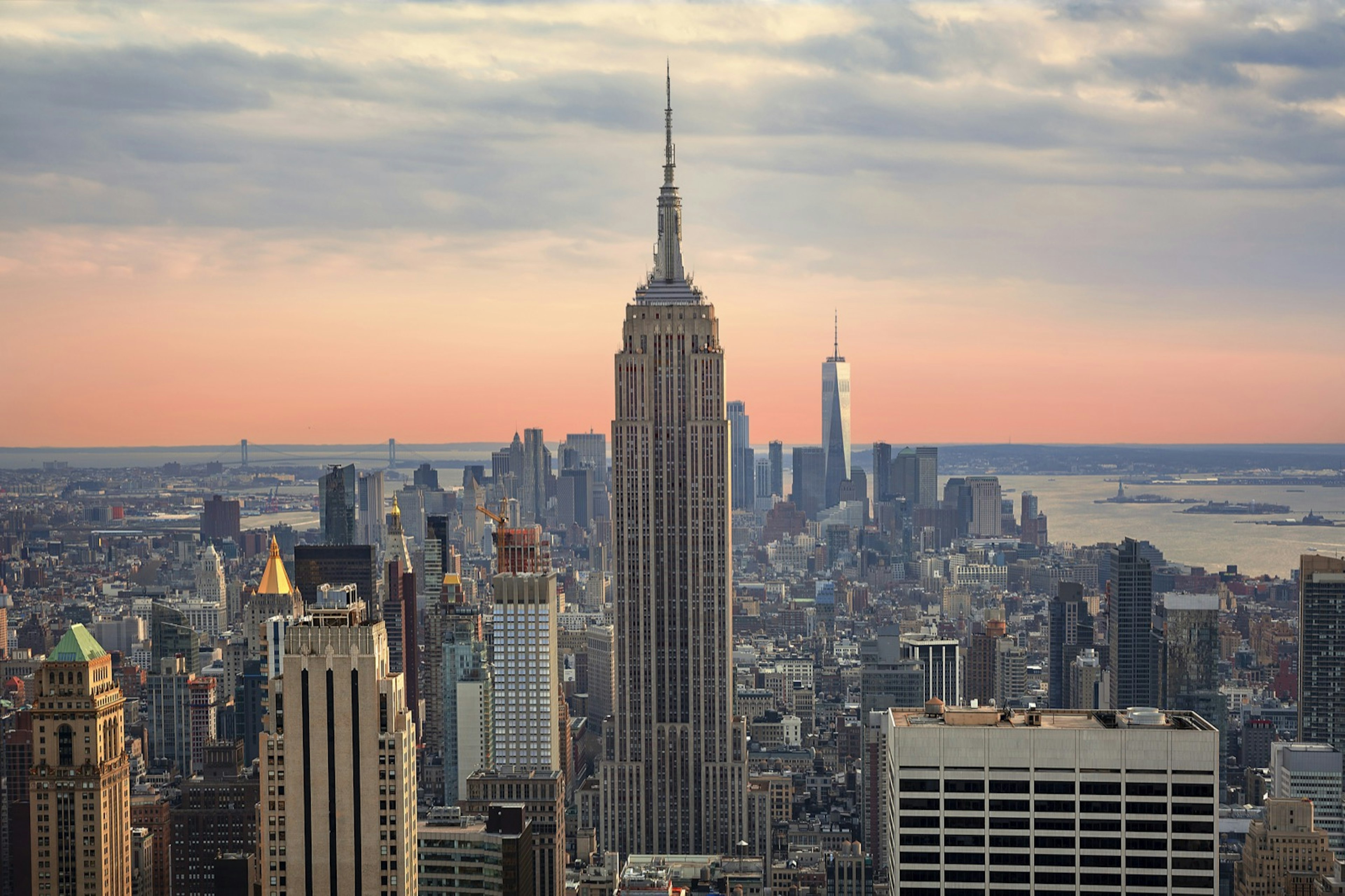 The Empire State Building at sunset is a beautiful site, but it is a New York City landscape you can skip. Instead watch the sunset from another New York City building