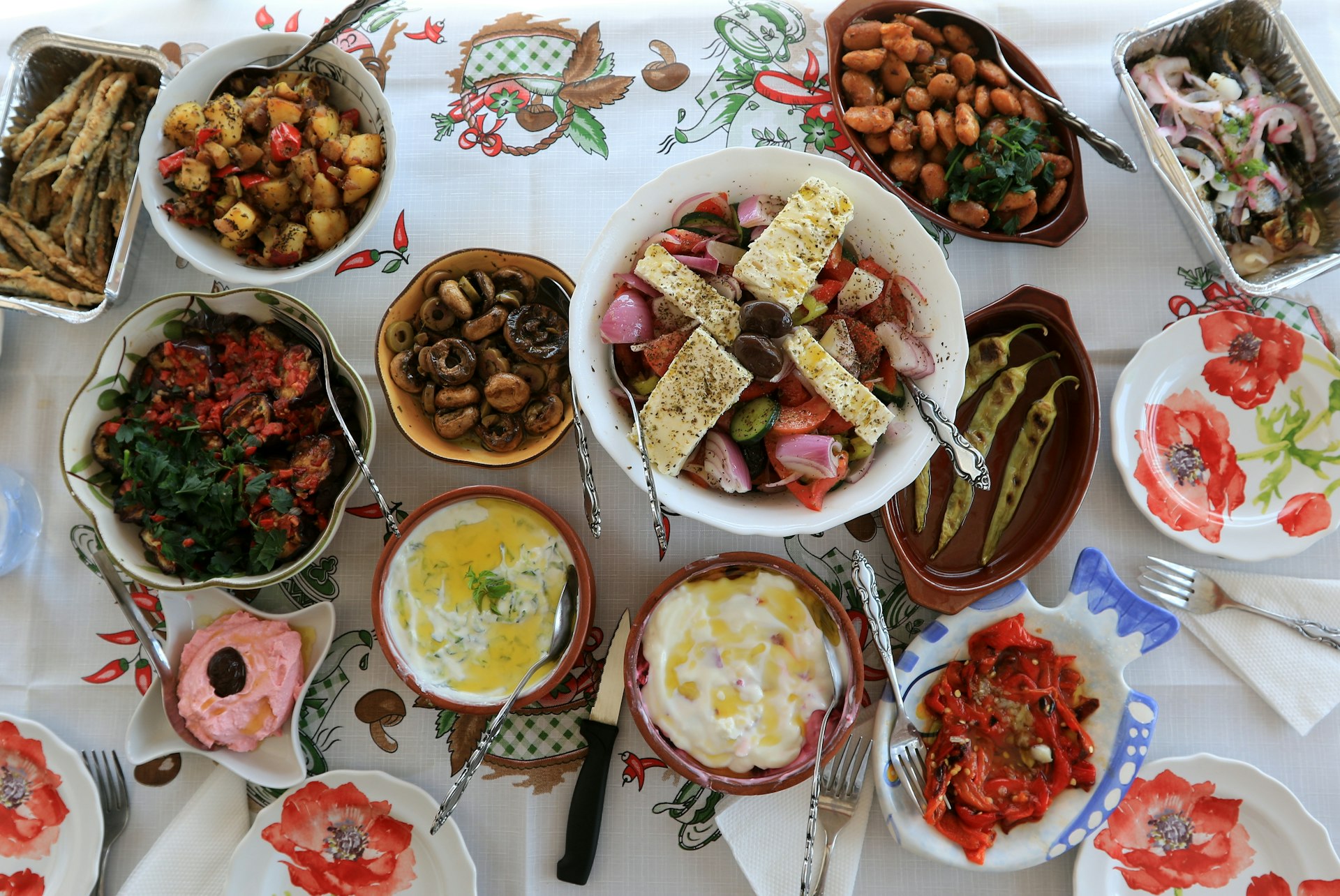 Table laid with various Greek dishes ready to eat