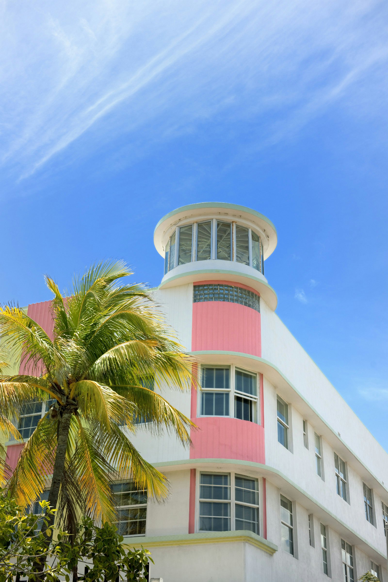 Cities for architecture lovers - an art deco building against a blue sky backdrop