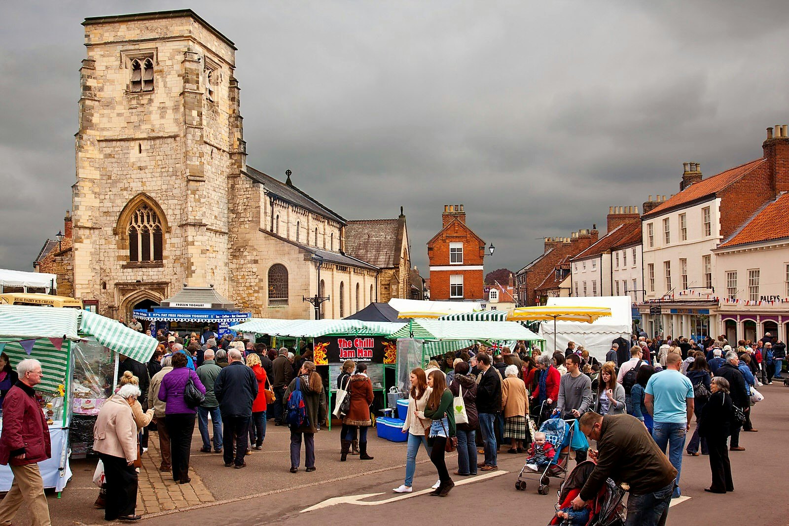 People wander around the busy food stalls in Malton town centre.