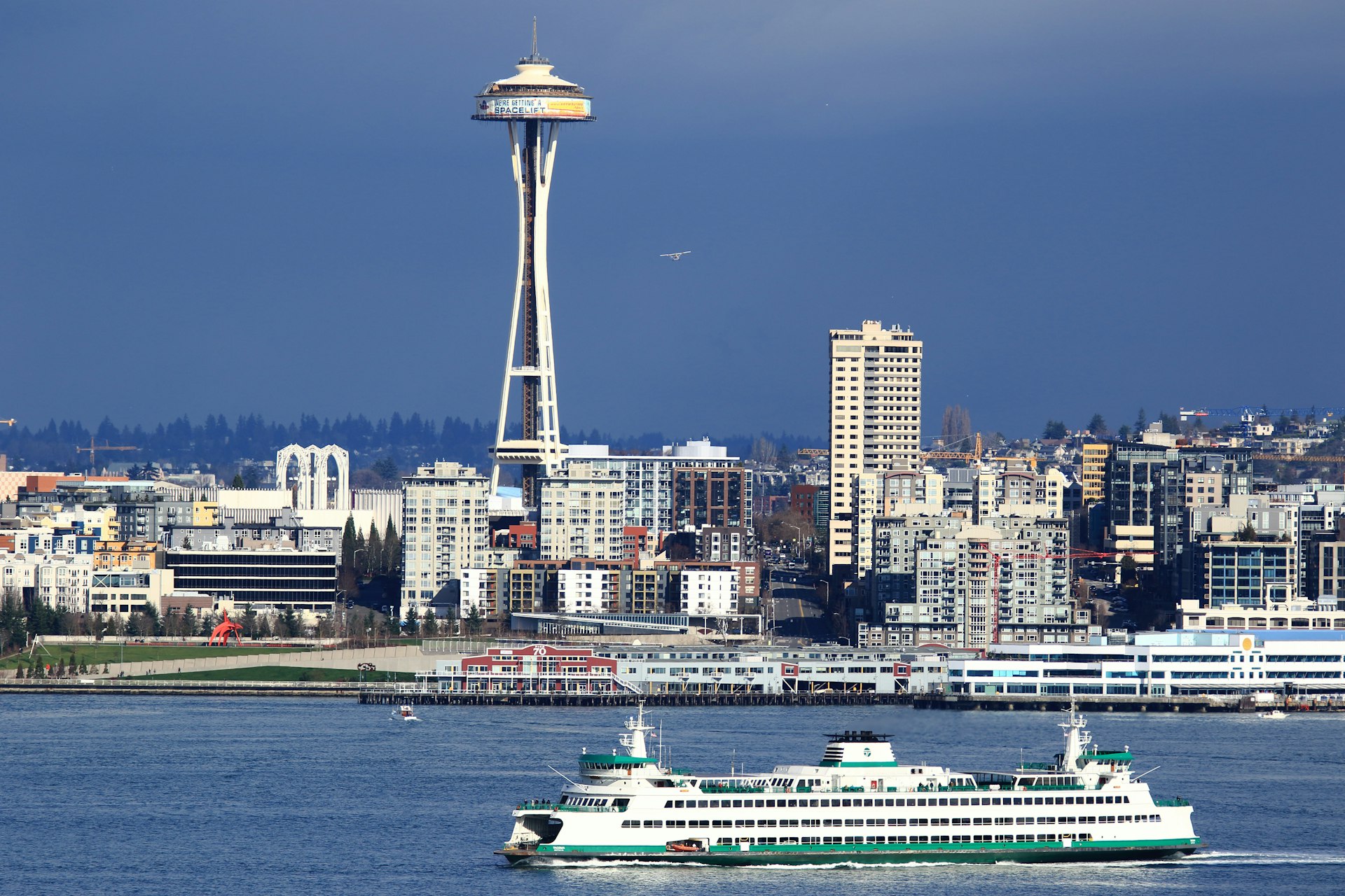 The Space Needle restaurant with a large boat in the foreground