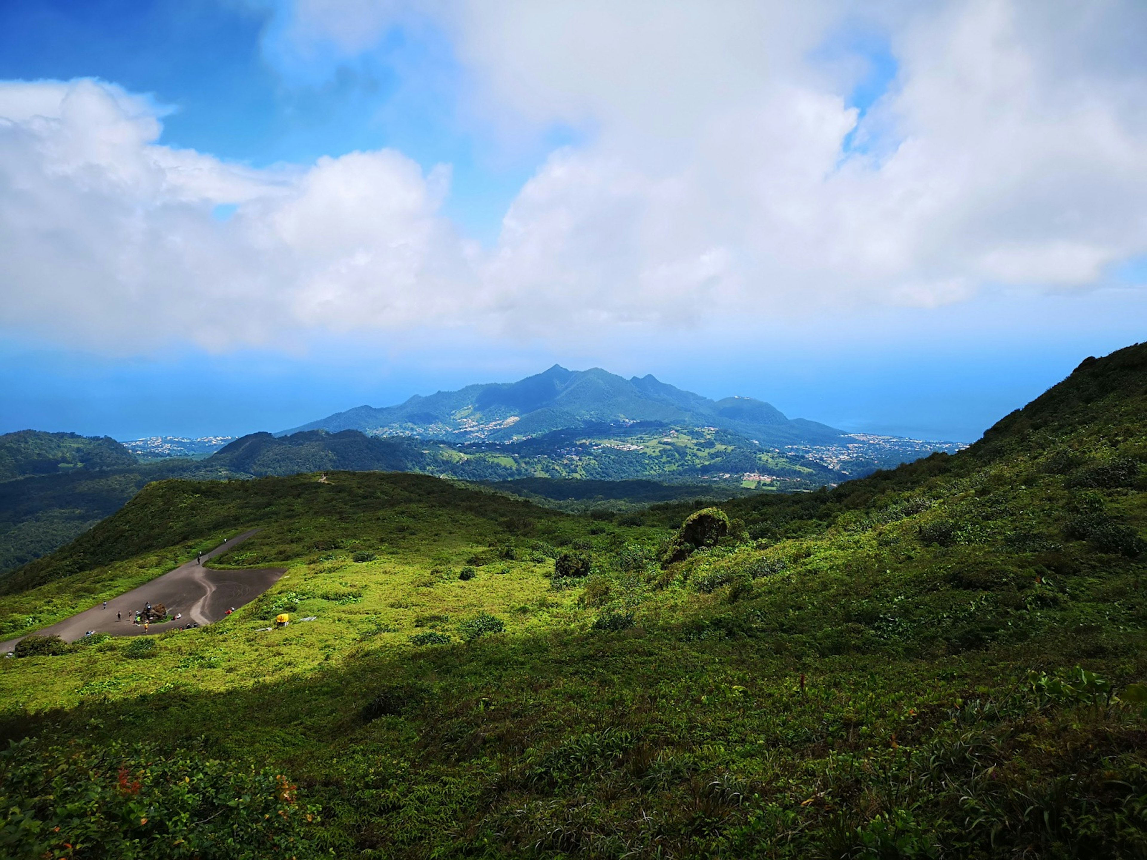 White clouds hover above the volcano, La Soufrière, in Guadeloupe © Laura French/ Lonely Planet