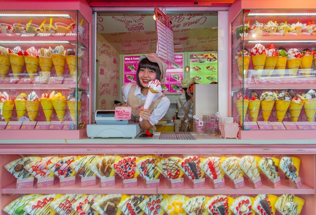 Colourful crepe and ice cream vendor at Tokyo's Harajuku's Takeshita Street, known for it's colourful shops, punk manga and overall anime look.