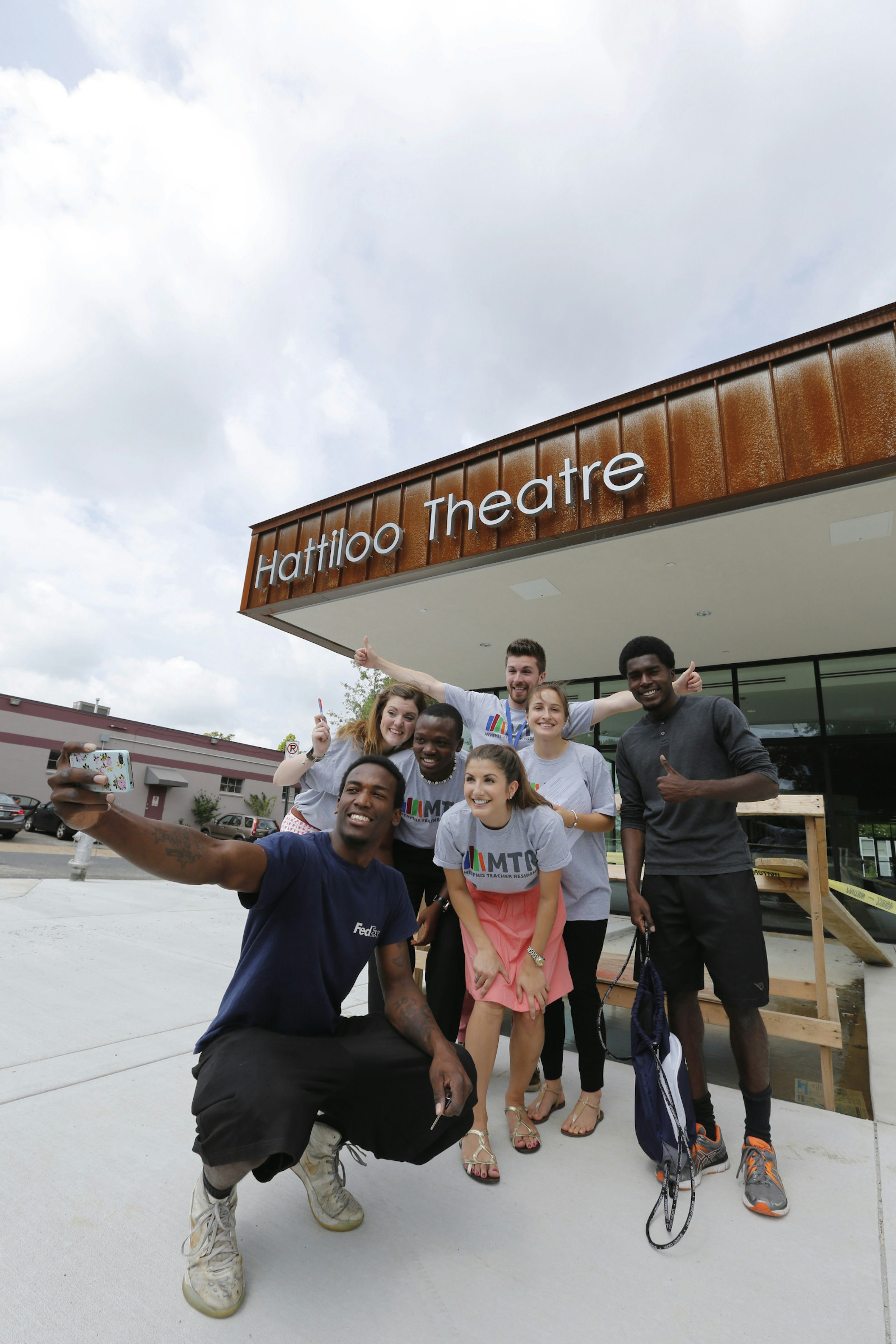 Group takes photo in front of modern-looking Hattiloo Theatre © Justin Fox Burks / Memphis Convention & Visitors Bureau