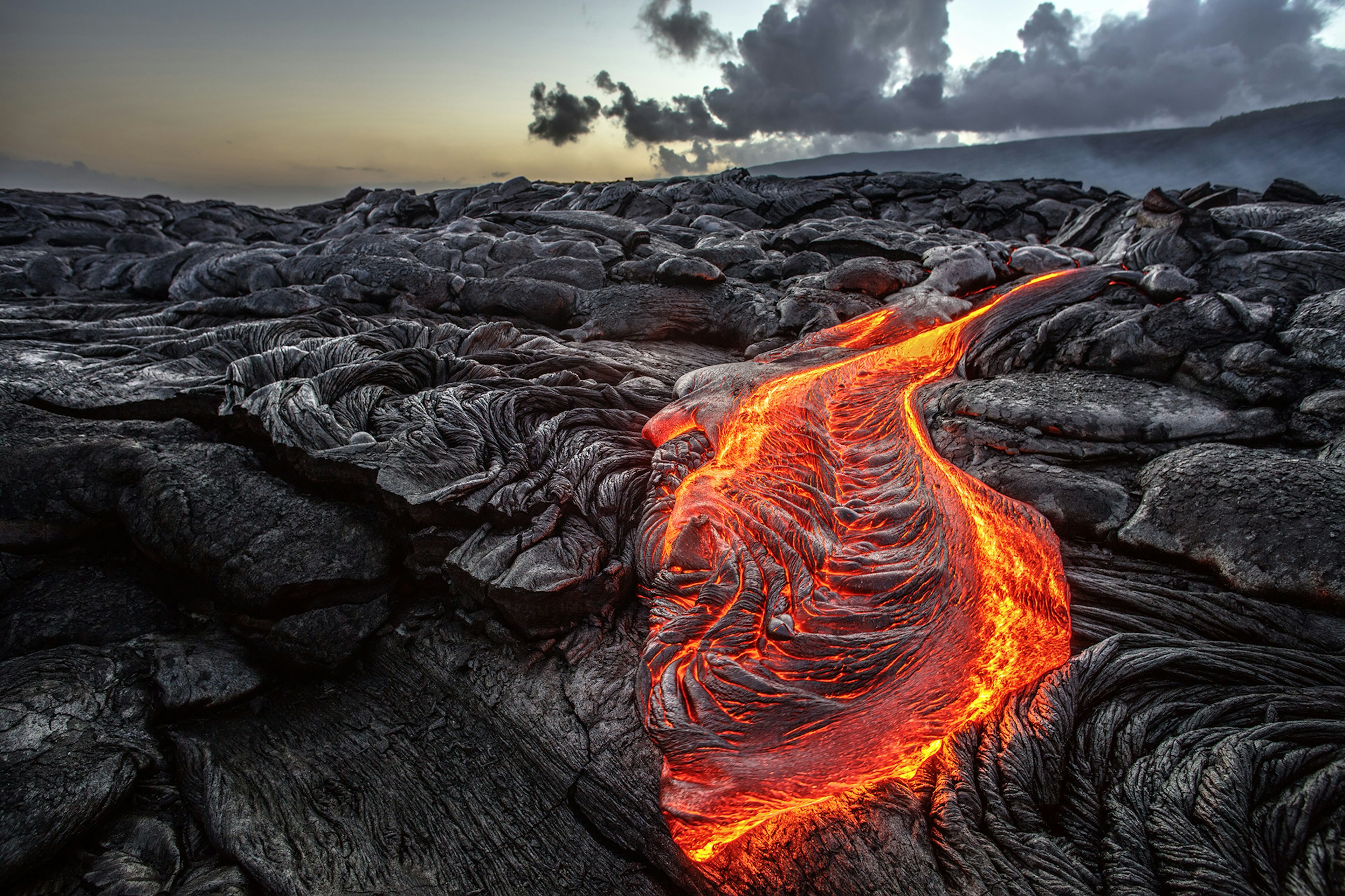 Red Orange vibrant Molten Lava flowing onto grey lavafield and glossy rocky land near hawaiian volcano with vog on background
614530238
active, big, black, crater, danger, dangerous, eruption, explosion, fire, flow, geology, hawaii, heat, hot, island, kilauea, lake, landscape, lava, magma, molten, mountain, nature, ocean, pacific, red, rock, smoke, travel, volcanic, volcano