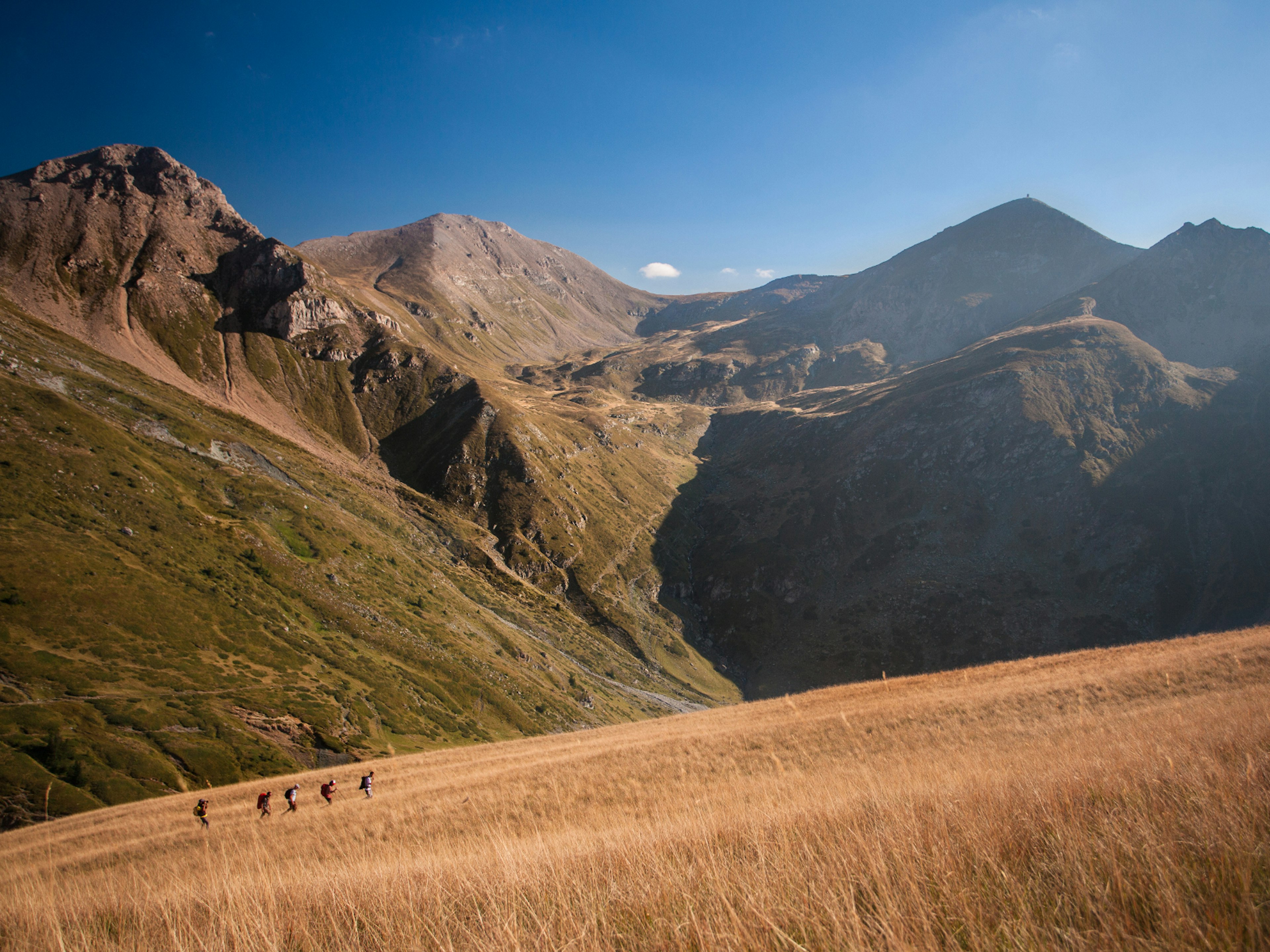 Hiking on Mt Plat (2398m), with Titov Vrv in the background © Nikola Spasenoski / Lonely Planet