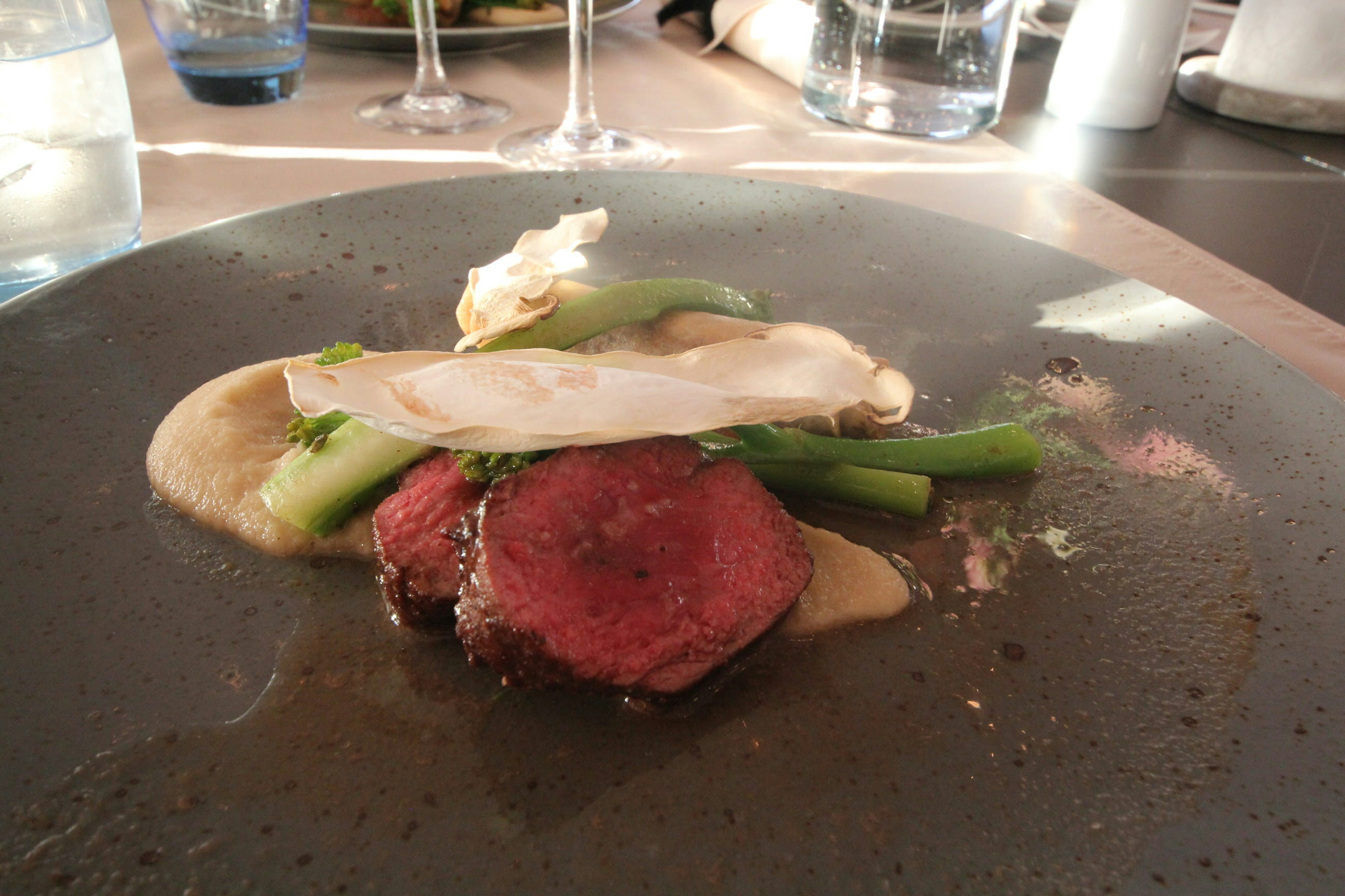 An artistically presented plate of food from the tasting menu at Sarfalik restaurant, Nuuk.