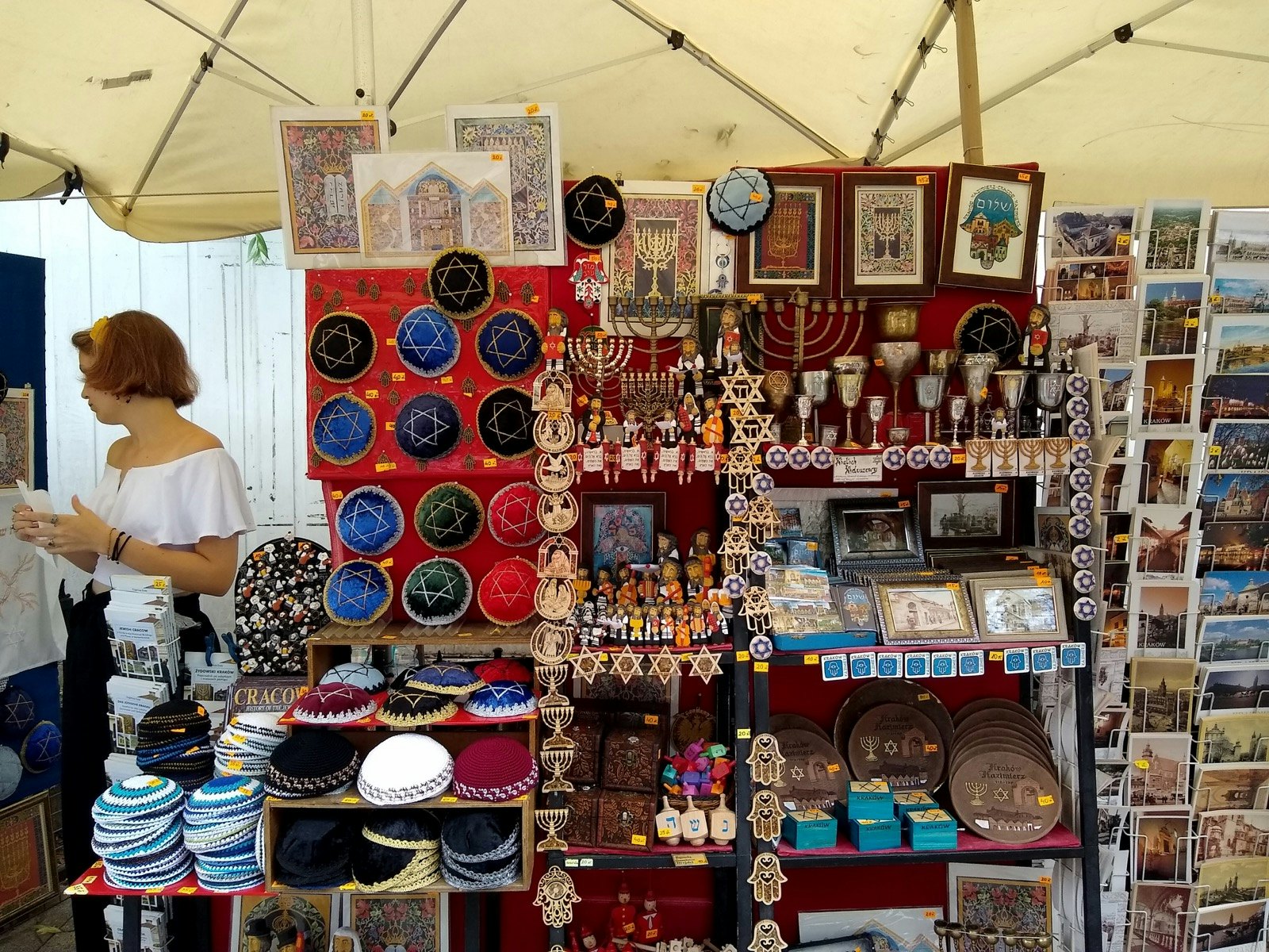 A display of various souvienirs, including artwork menorahs and figurines; Krakow Jewish cultural revival