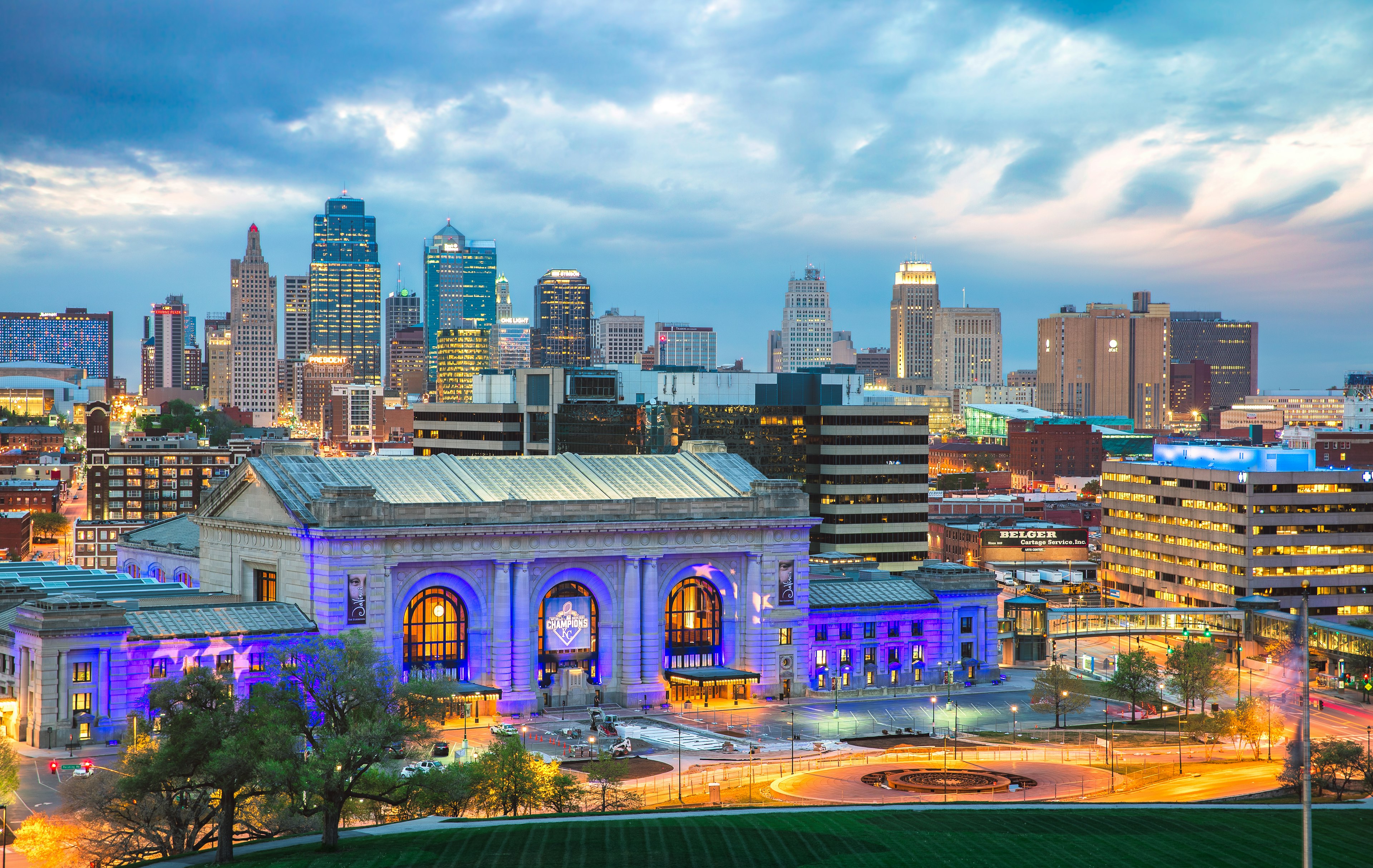 The bright lights of the Kansas City skyline at dusk; NFL bars