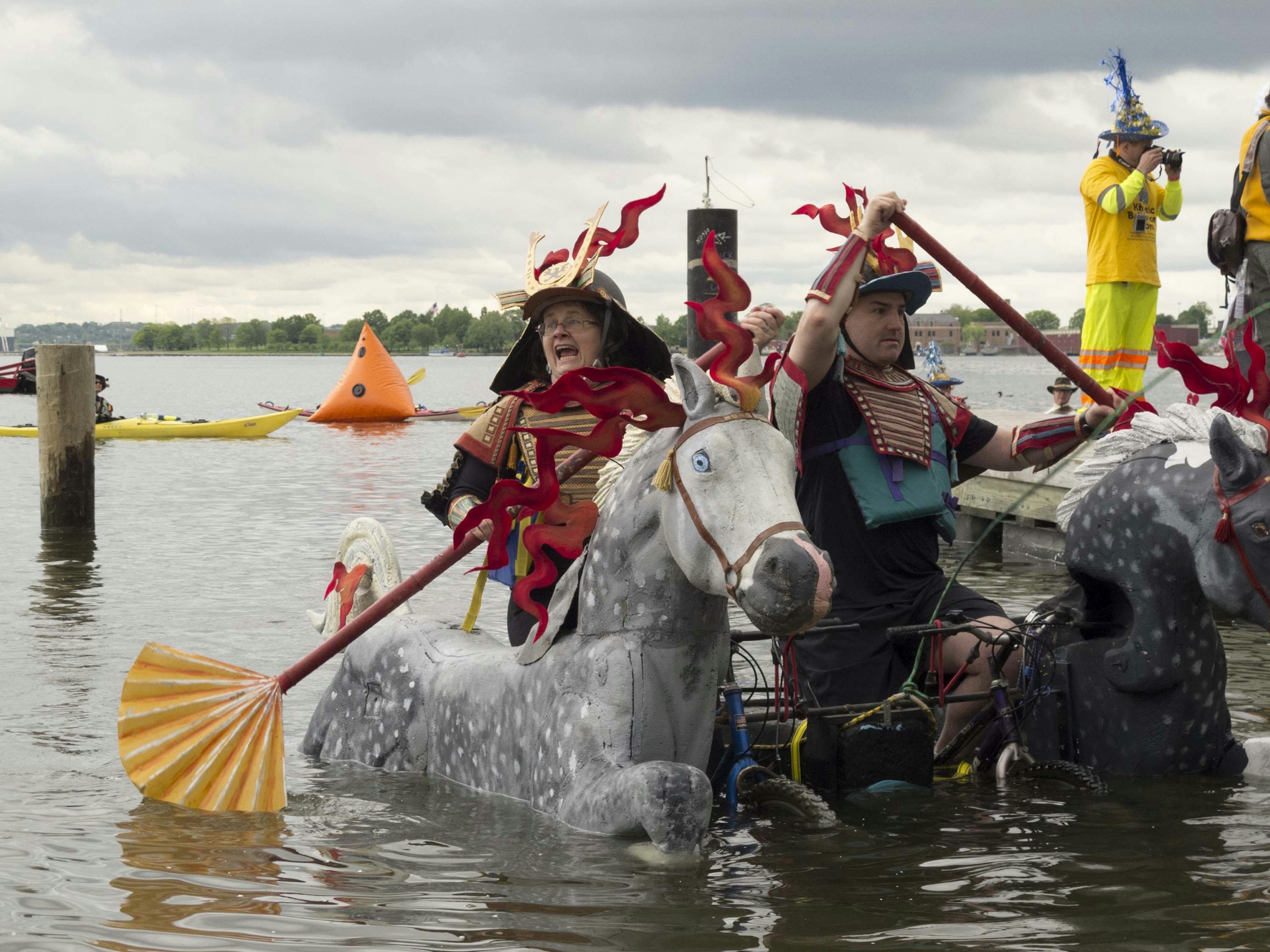 Two competitors paddle their kinetic vehicle in Chesapeake Bay, near Baltimore. Unique sporting events