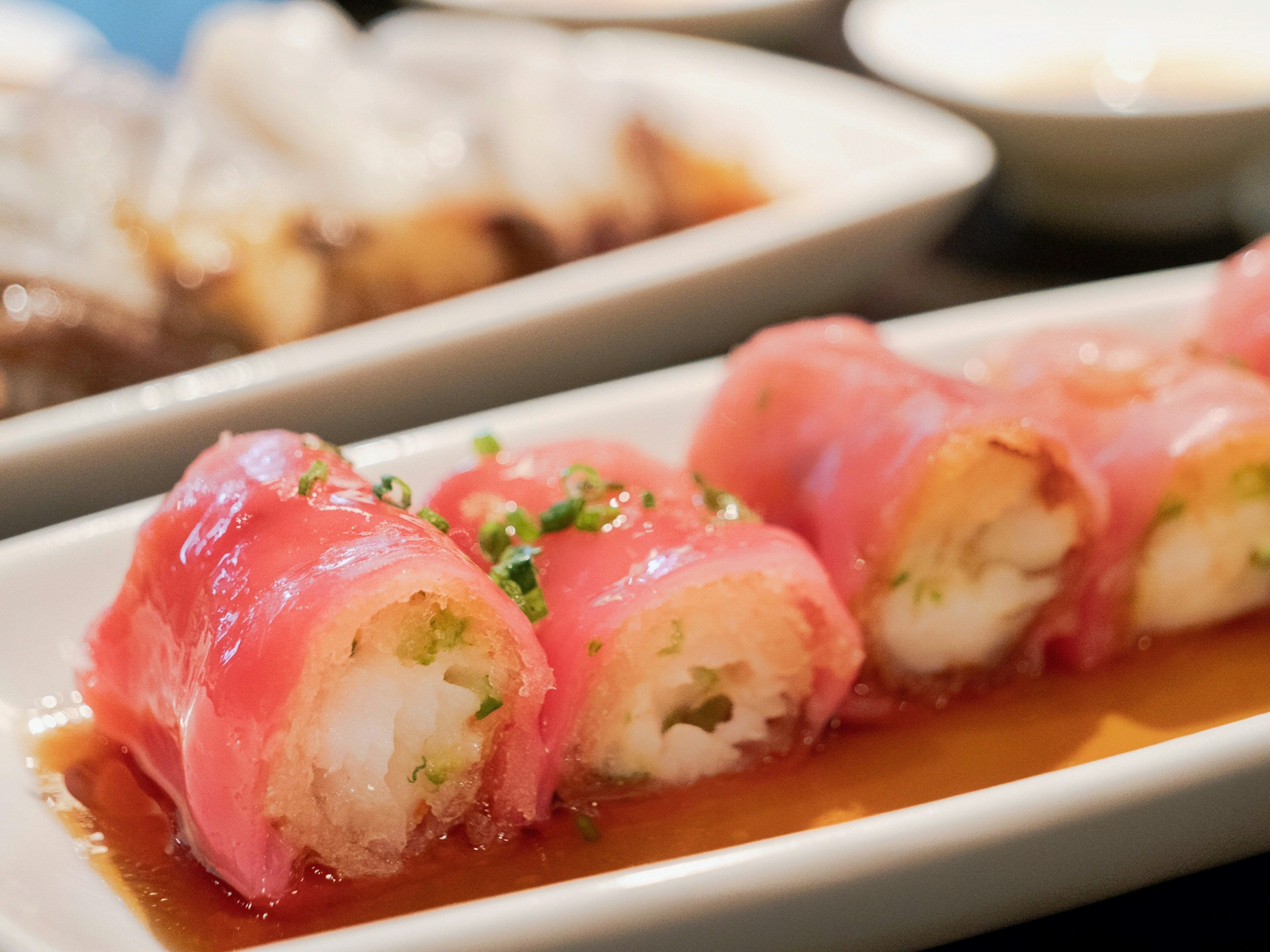 A close up of king prawn silver cod crispy red rice cheung fun at Hakkasan