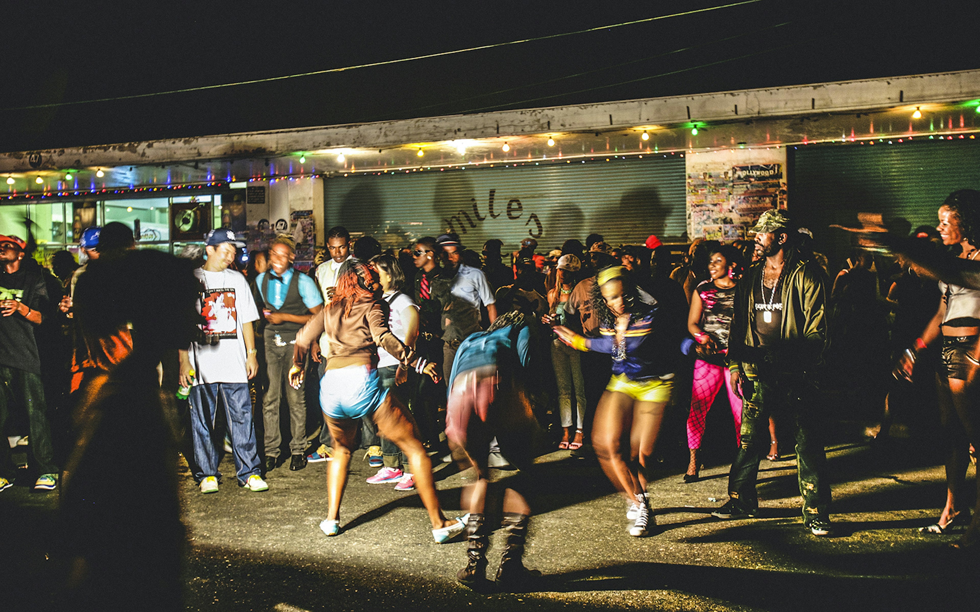 Kingston, Jamaica - June 26, 2008: Crowd enjoying reggae/dancehall music and dancing at ghetto street party, called "Passa Passa", Tivoli Gardens.
472046721
African Descent, Developing Countries, Dancer, Leisure Activity, Ghetto, City Life, Kingston - Jamaica, Speaker, Reggae, Youth Culture, Music, Caribbean Culture, Young Adult, Dancing, Spectator, Relaxation, Multi Colored, Urban Scene, Outdoors, Crowd, People, Jamaica, Caribbean, Night, Dance Floor, Street, City, Party - Social Event, Jamaican Culture, Passa Passa