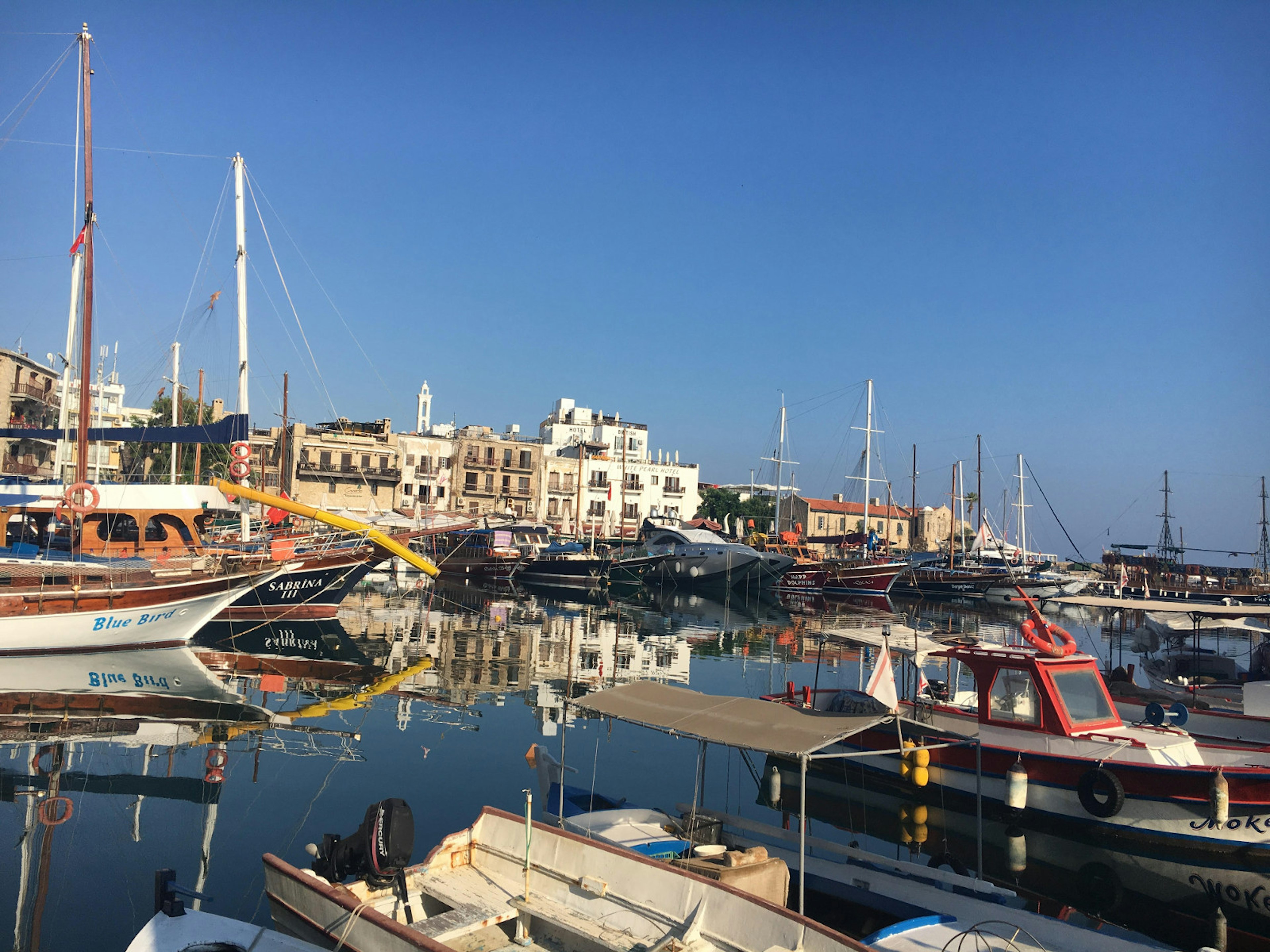 Fishing boats and traditional wooden ships moored in Kyrenia’s old harbour © Brana Vladisavljevic / Lonely Planet