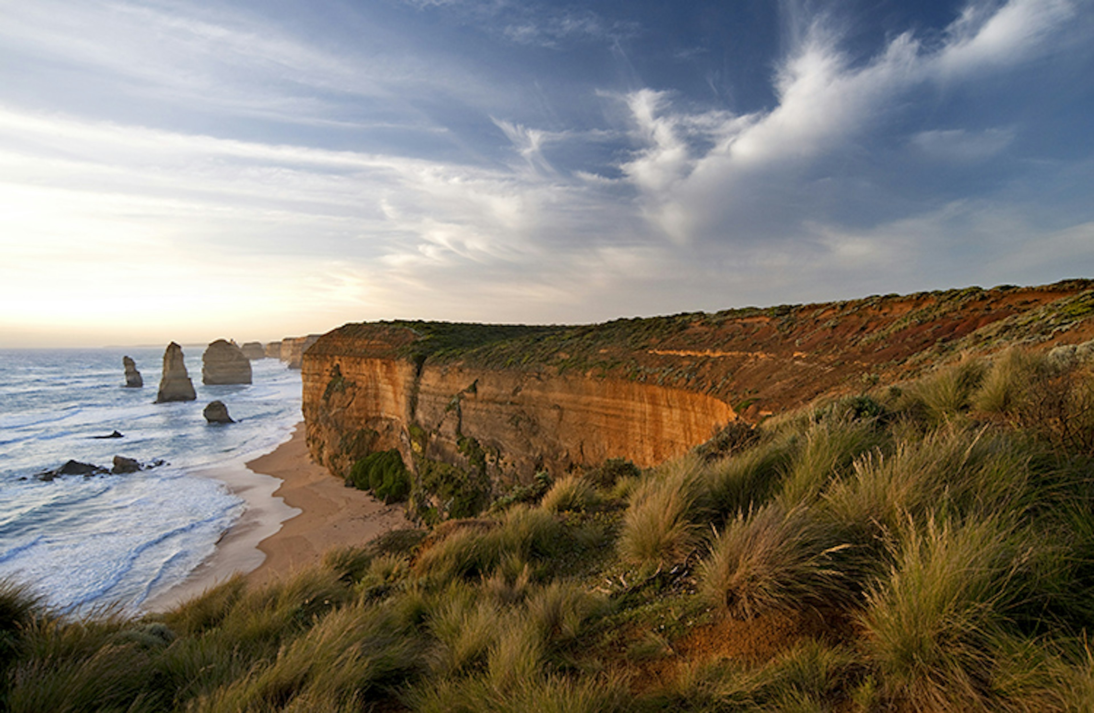 Twelve Apostles limestone stacks along rugged coastline.