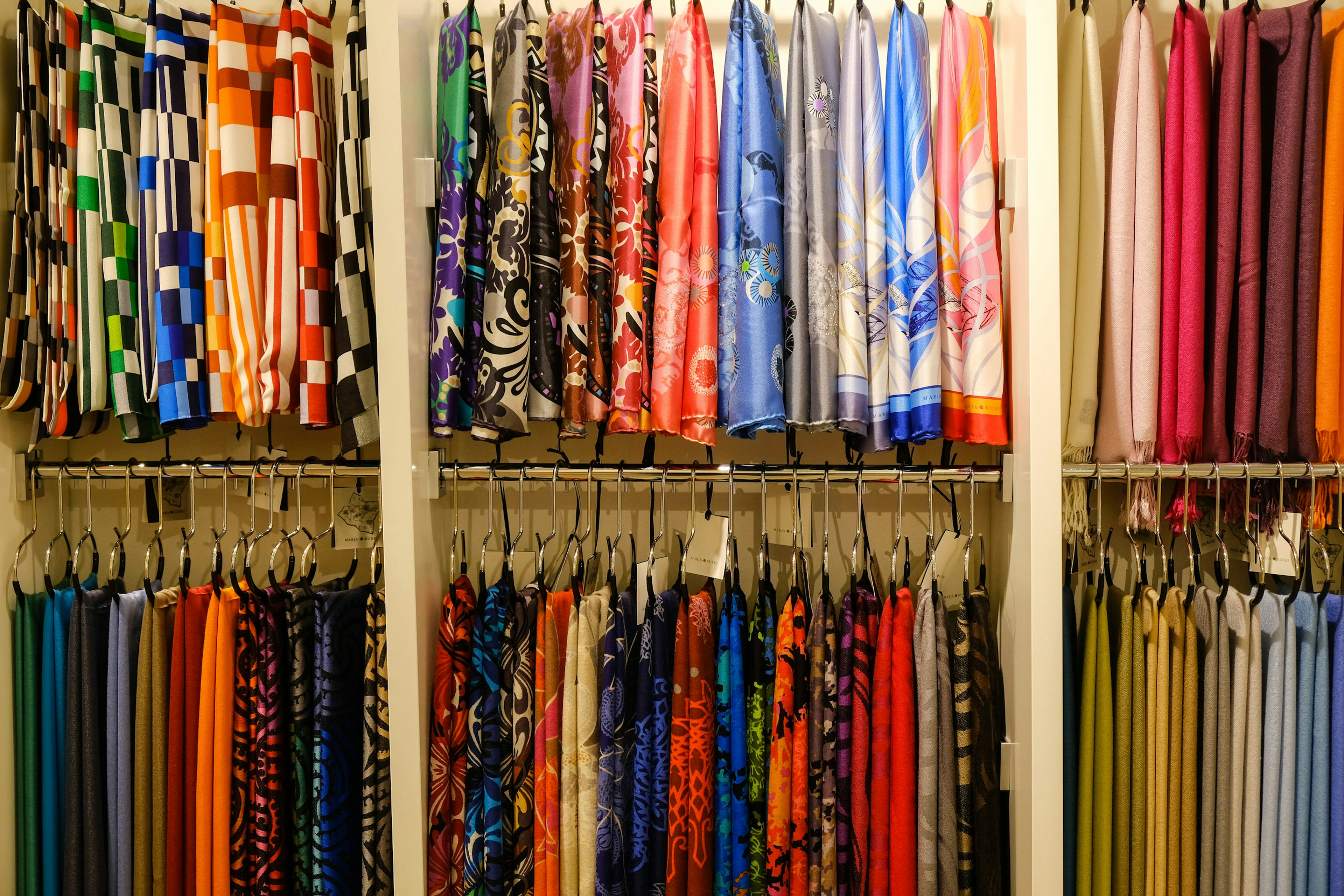 Neat display of silk scarves hanging up in the Marja Kurki store, Helsinki © Tim Bird / ϰϲʿ¼