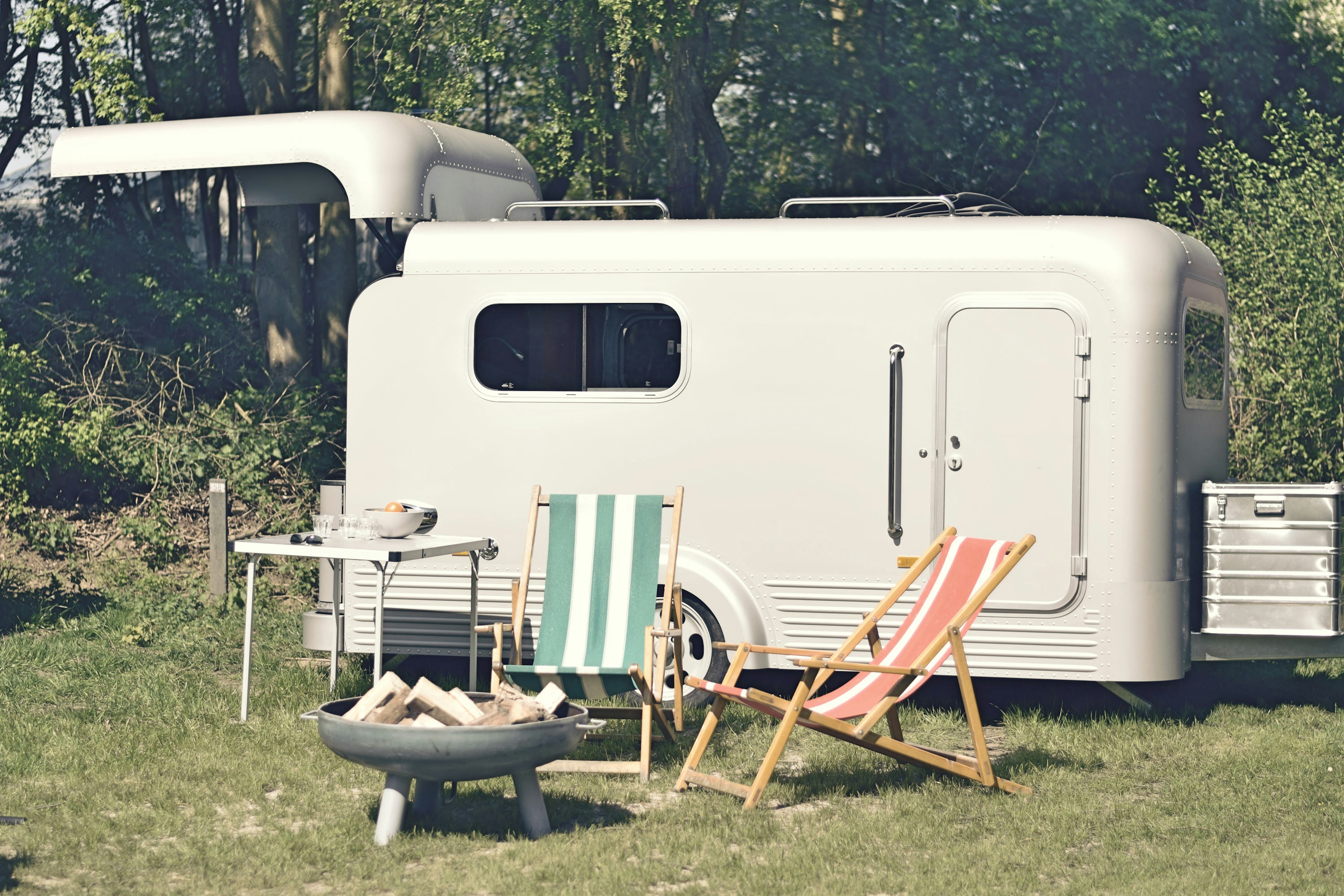 The small LUME trailer at a campsite.