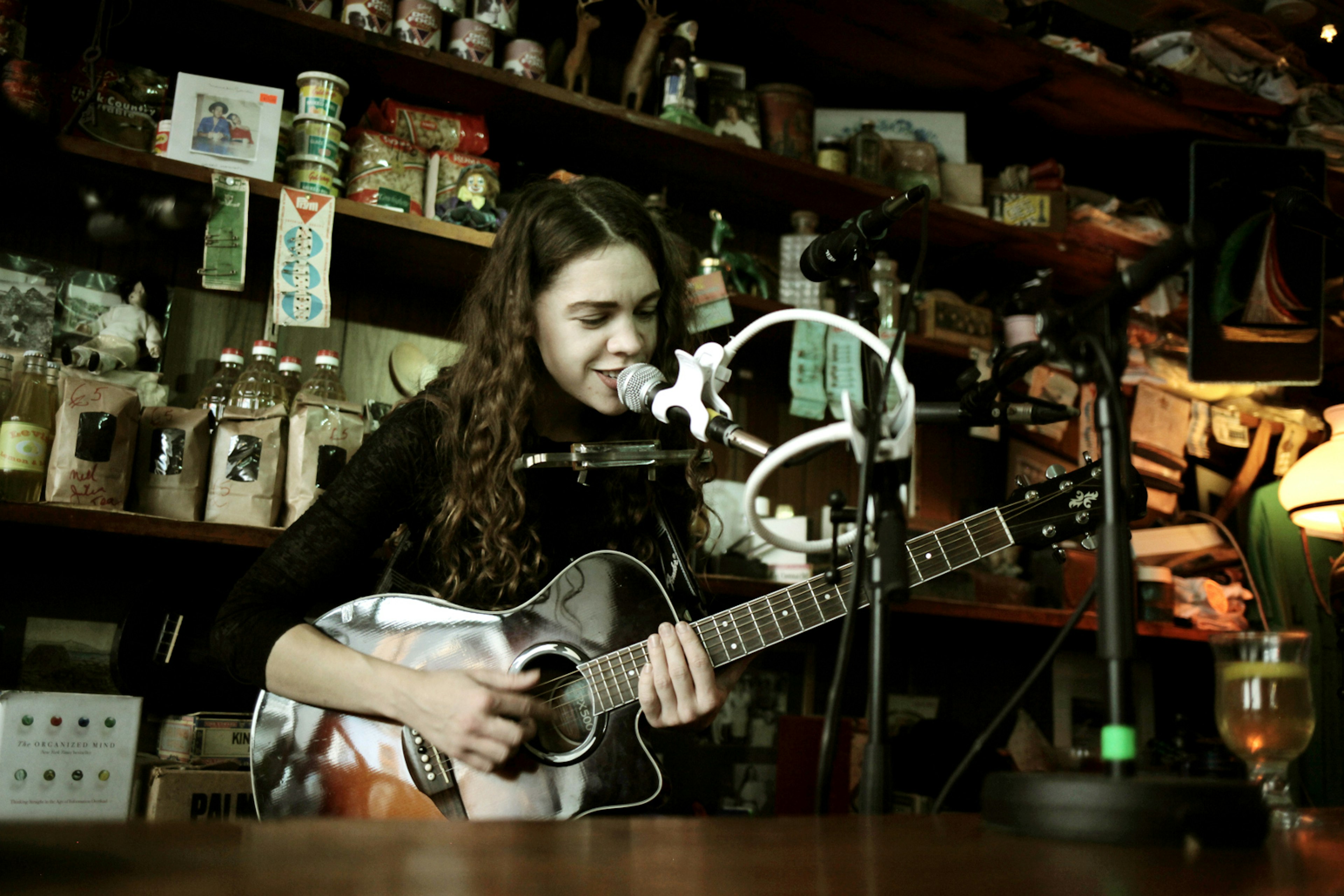 SON performing behind the counter at Levis in Ballydehob