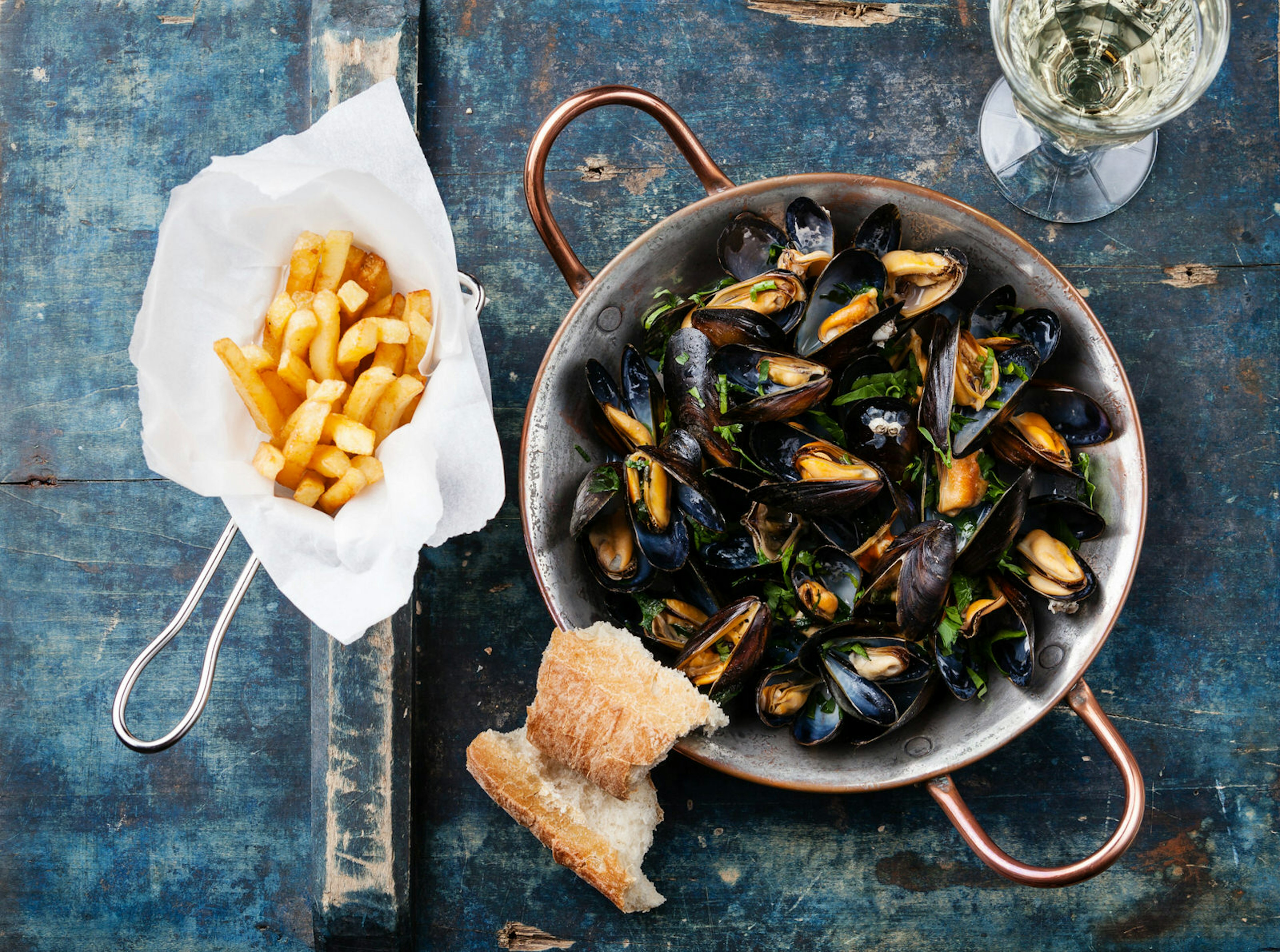 When in Belgium, try the moules-frites © Lisovskaya Natalia/Shutterstock