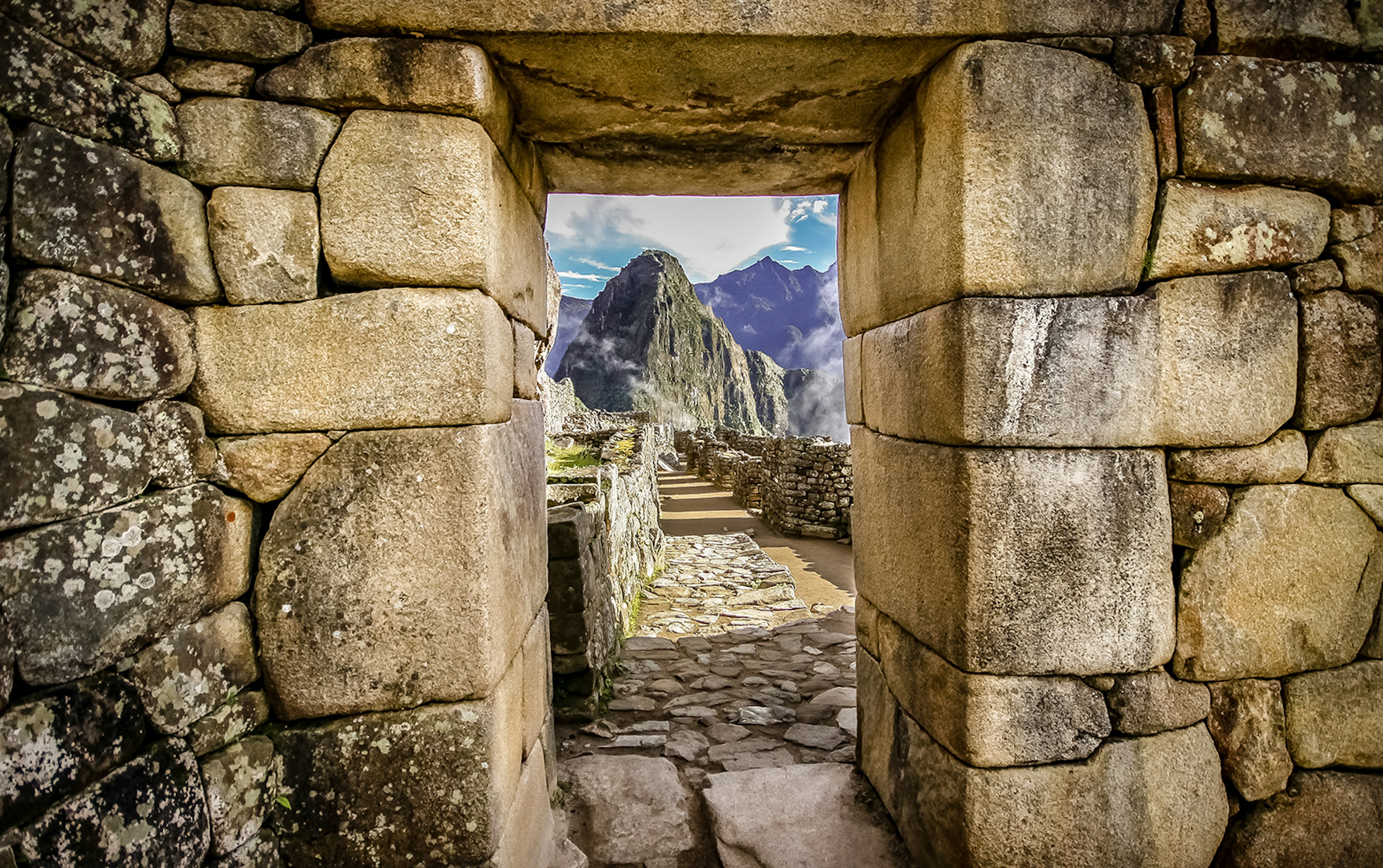 Shot of Machu Picchu through a stone doorway at the site © Uwe Bergitz / shutterstock